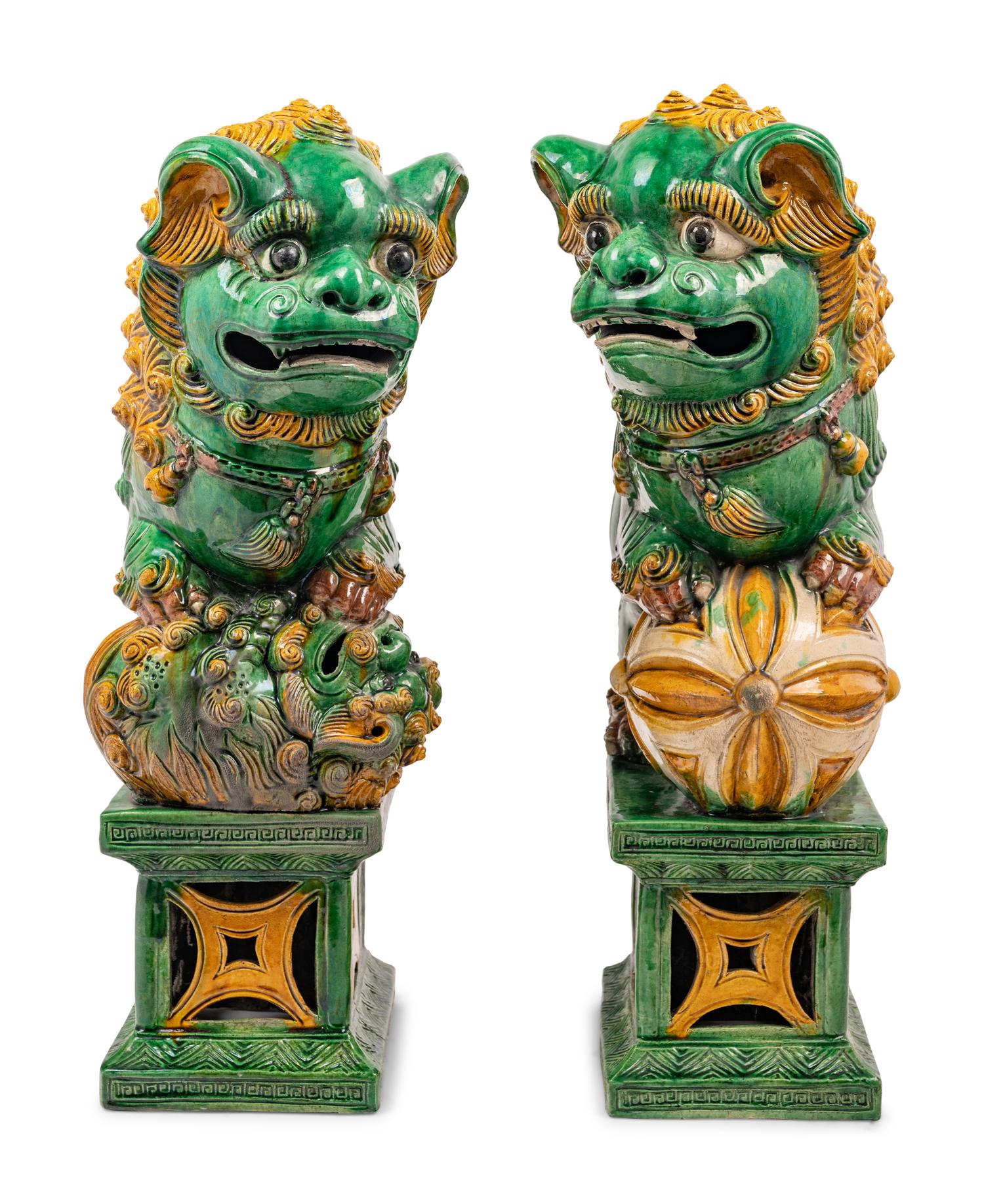 A Pair of Chinese Sancai Glazed Porcelain Figures of Fu Lions