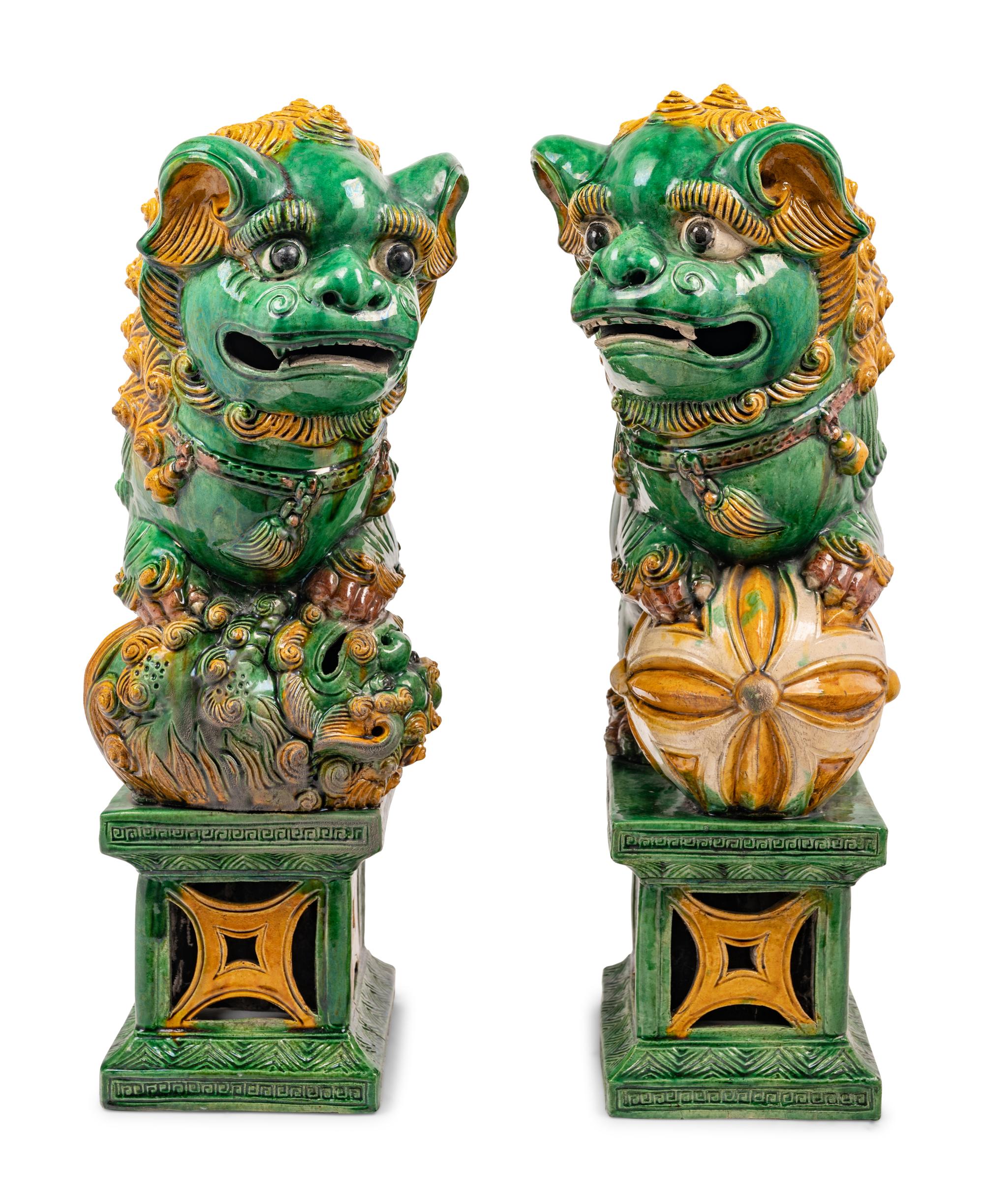 A Pair of Chinese Sancai Glazed Porcelain Figures of Fu Lions