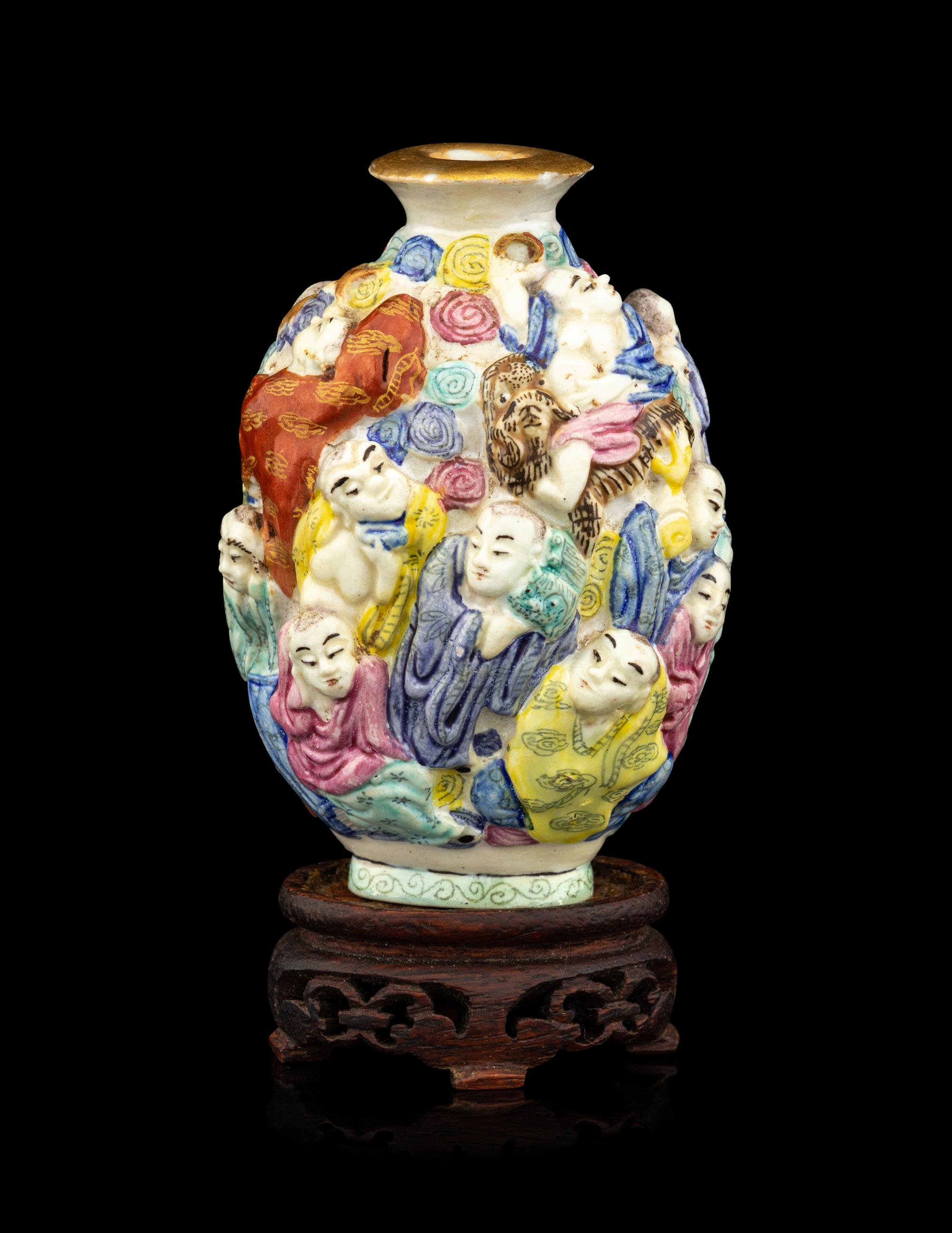 A Chinese Molded Famille Rose Porcelain Snuff Bottle