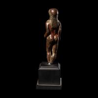 A Greek Bronze Kouros
