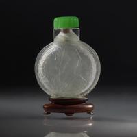 A Chinese Carved "Spanish Coin" Snuff Bottle, Qing Dynasty, Circa 1800-1850 — 1800-1850年 西班牙銀幣紋鼻煙壺