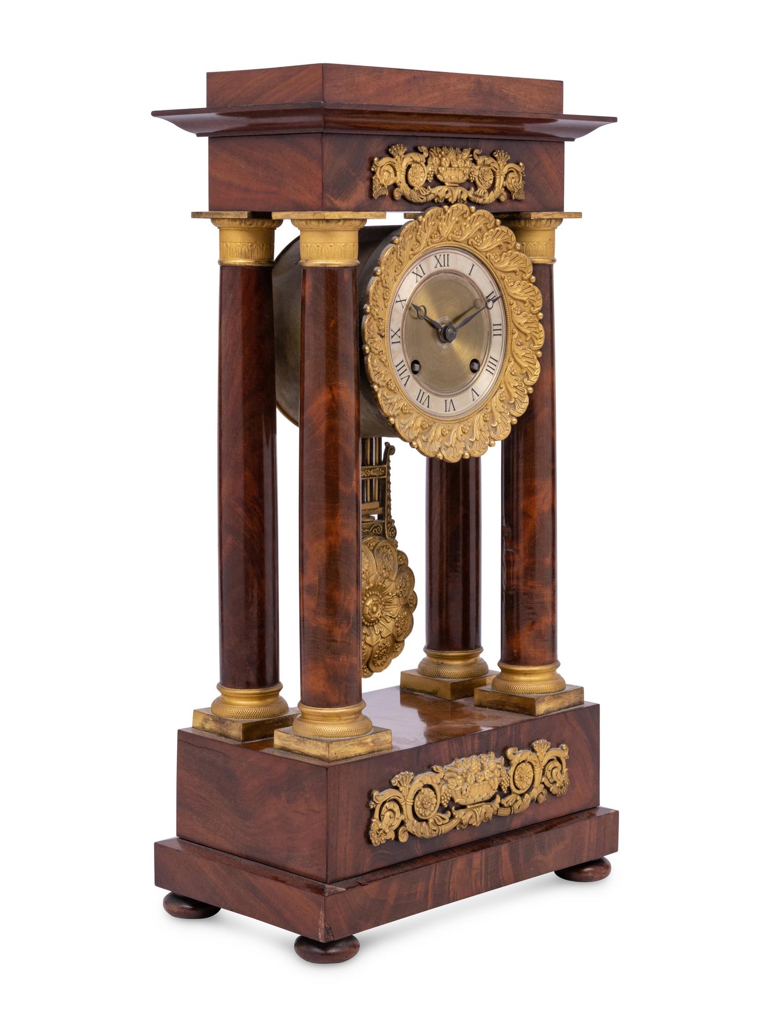 A Charles X Gilt Bronze Mounted Mahogany Portico Clock