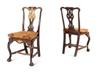 A Pair of Portuguese Parcel-Gilt and Carved Walnut Side Chairs