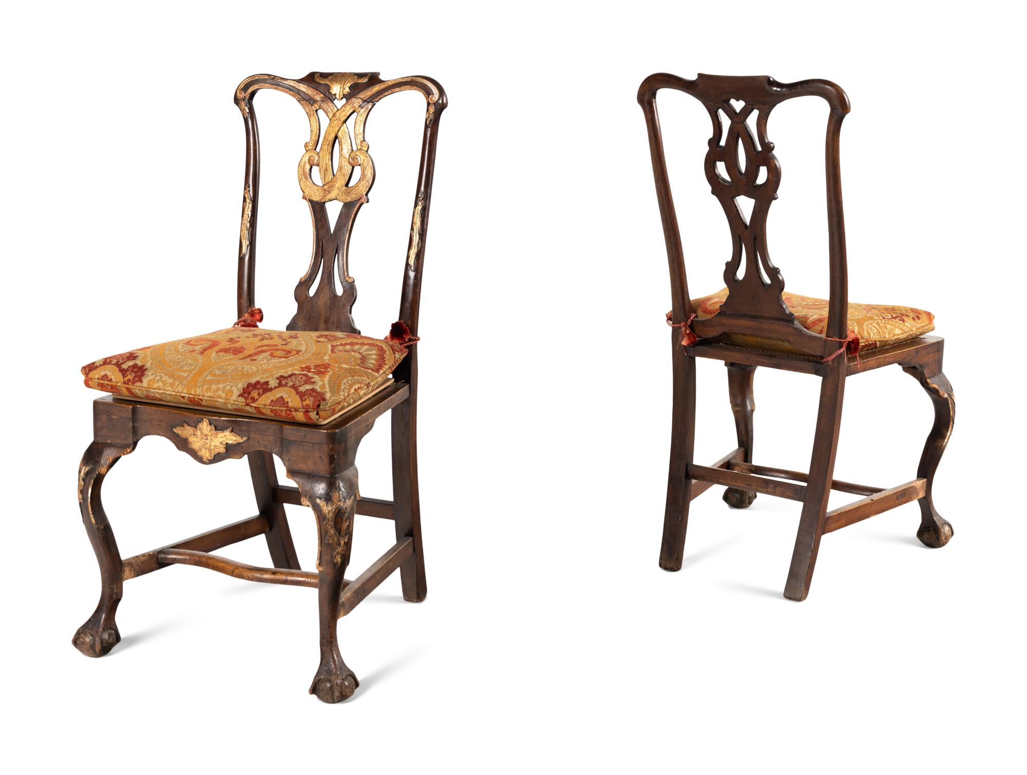 A Pair of Portuguese Parcel-Gilt and Carved Walnut Side Chairs