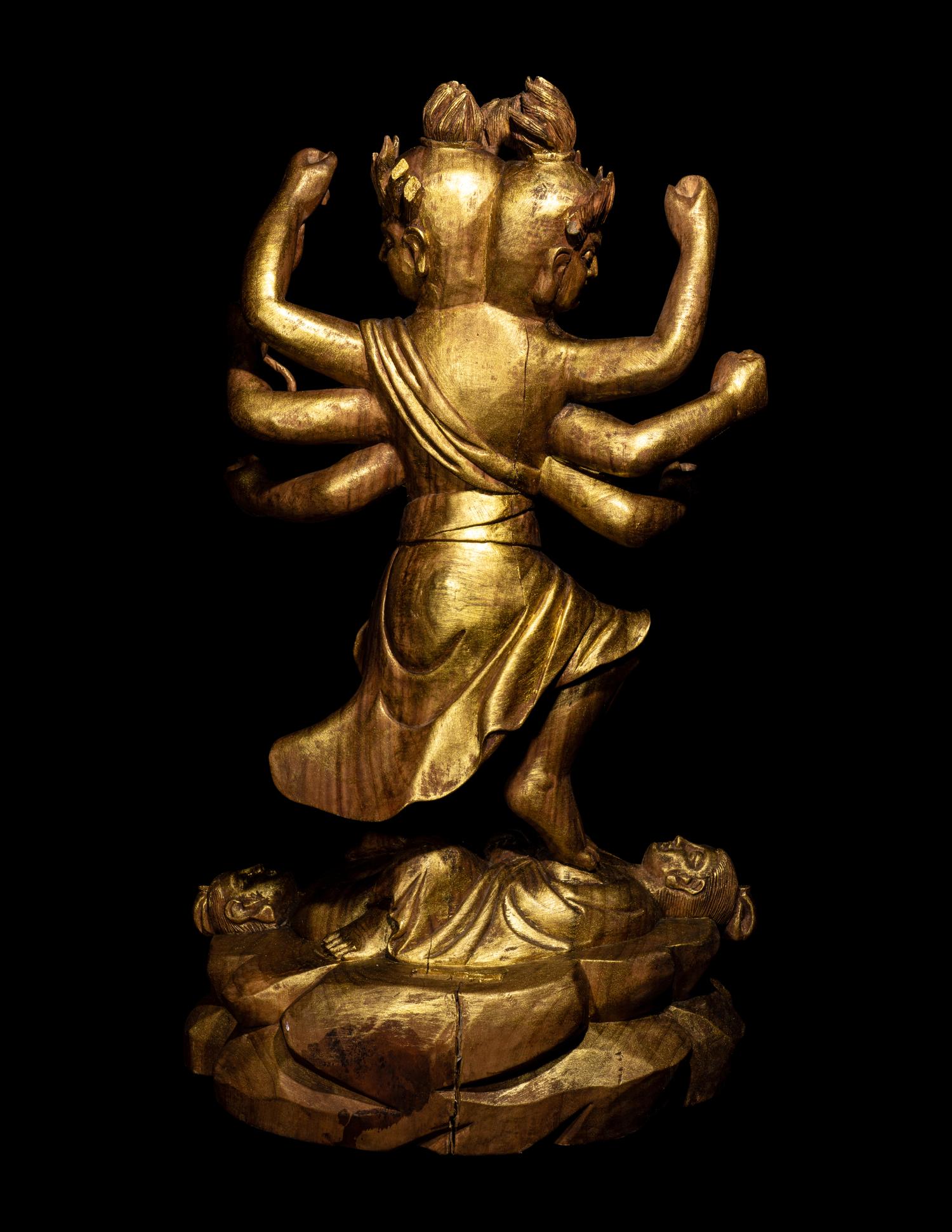 A Chinese Gilt Lacquered Wood Figure of a Deity