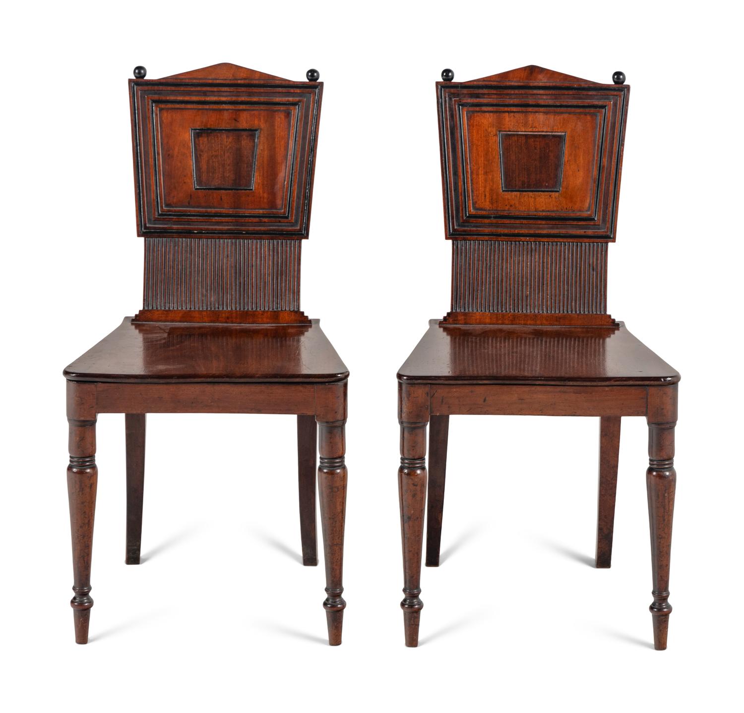 A Pair of William IV Carved Mahogany Hall Chairs
