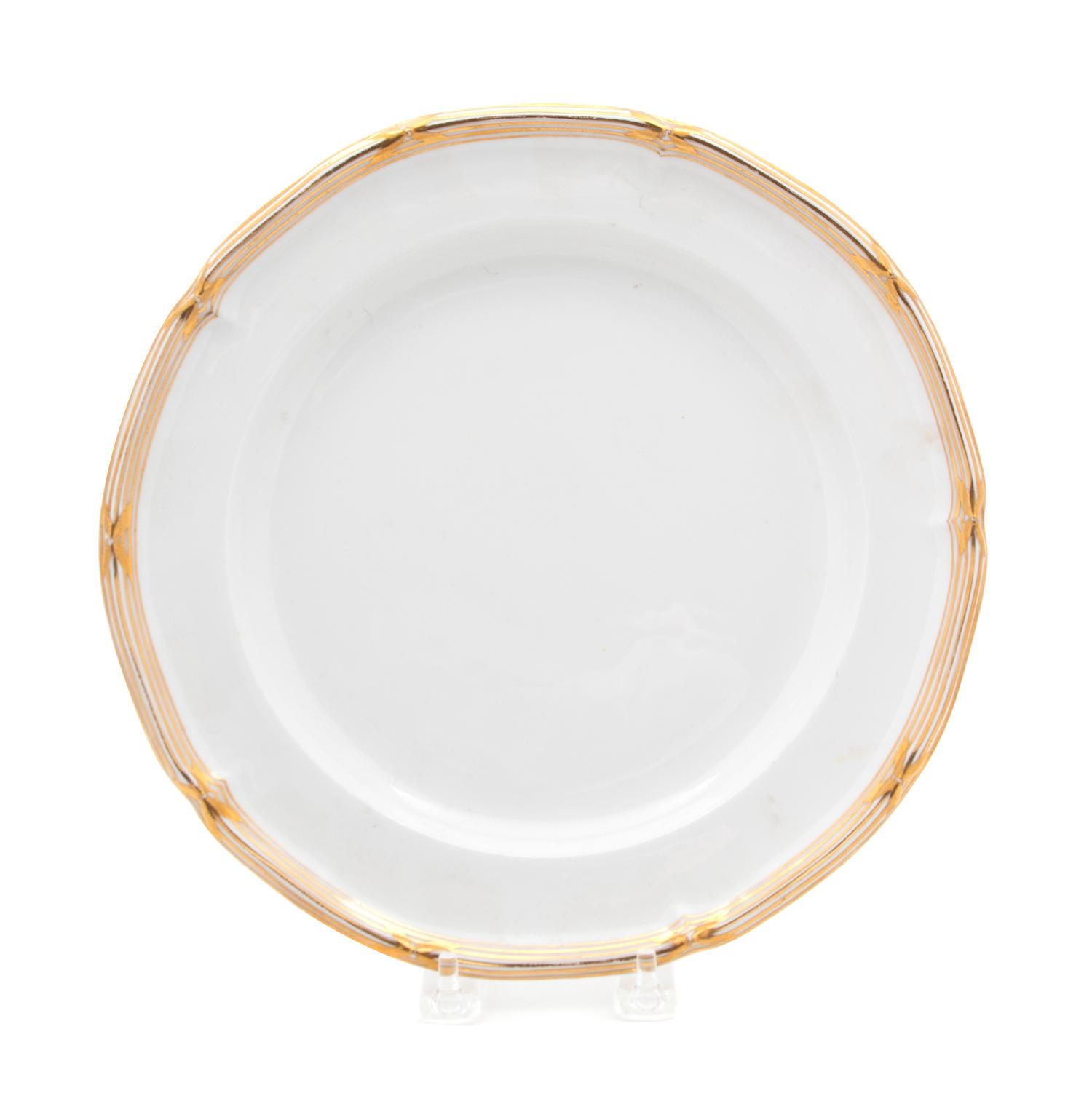 A Set of Sixteen English Gilt Decorated Porcelain Plates