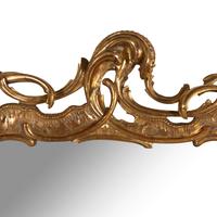 A Rococo Style Giltwood Mirror