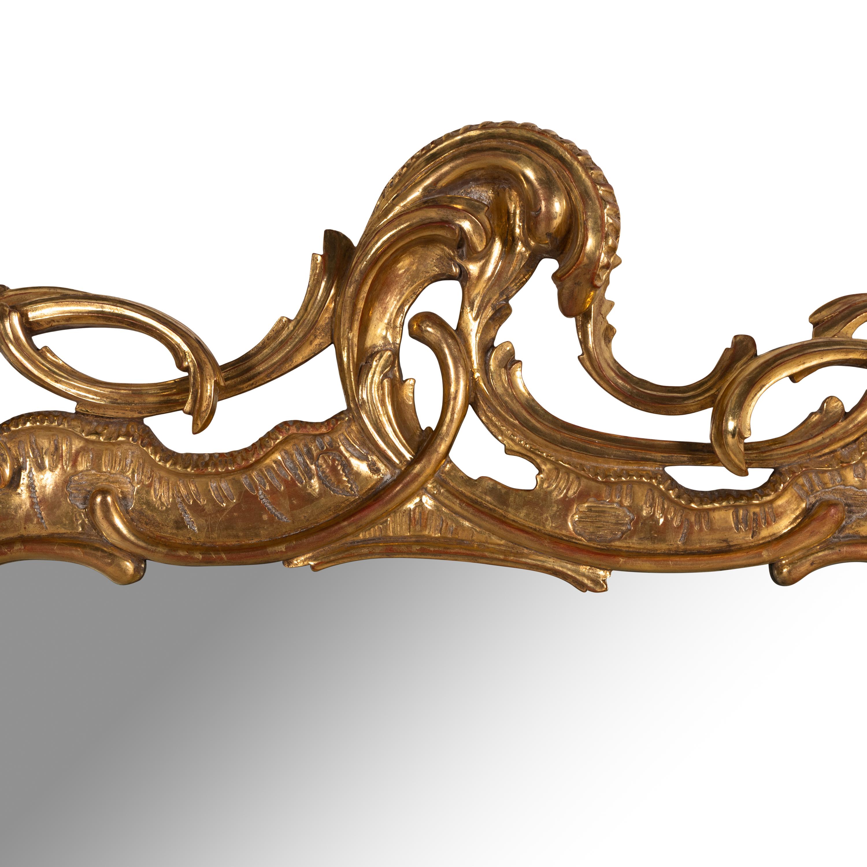 A Rococo Style Giltwood Mirror