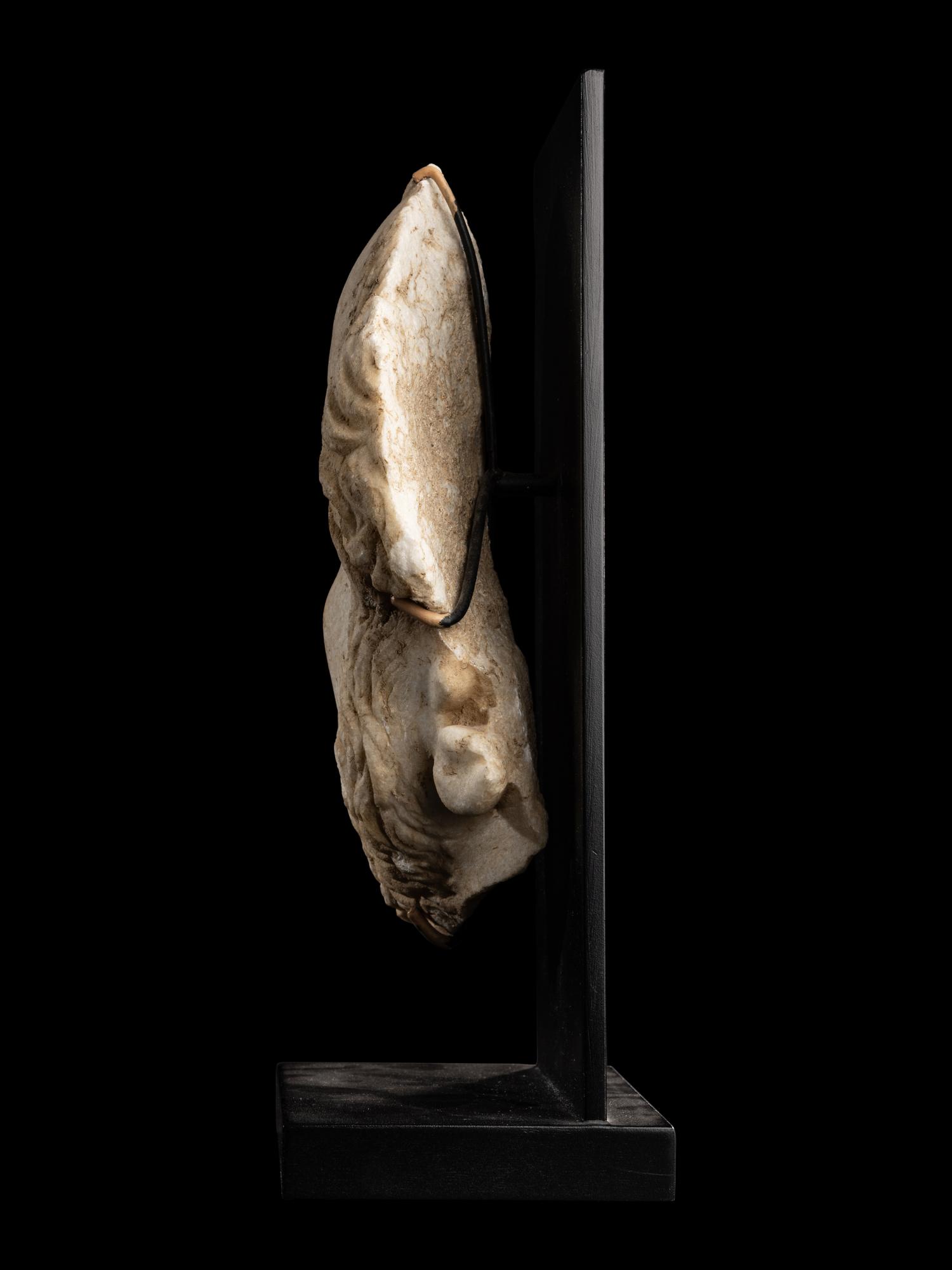 A Roman Marble Fragmentary Portrait Head of a Man