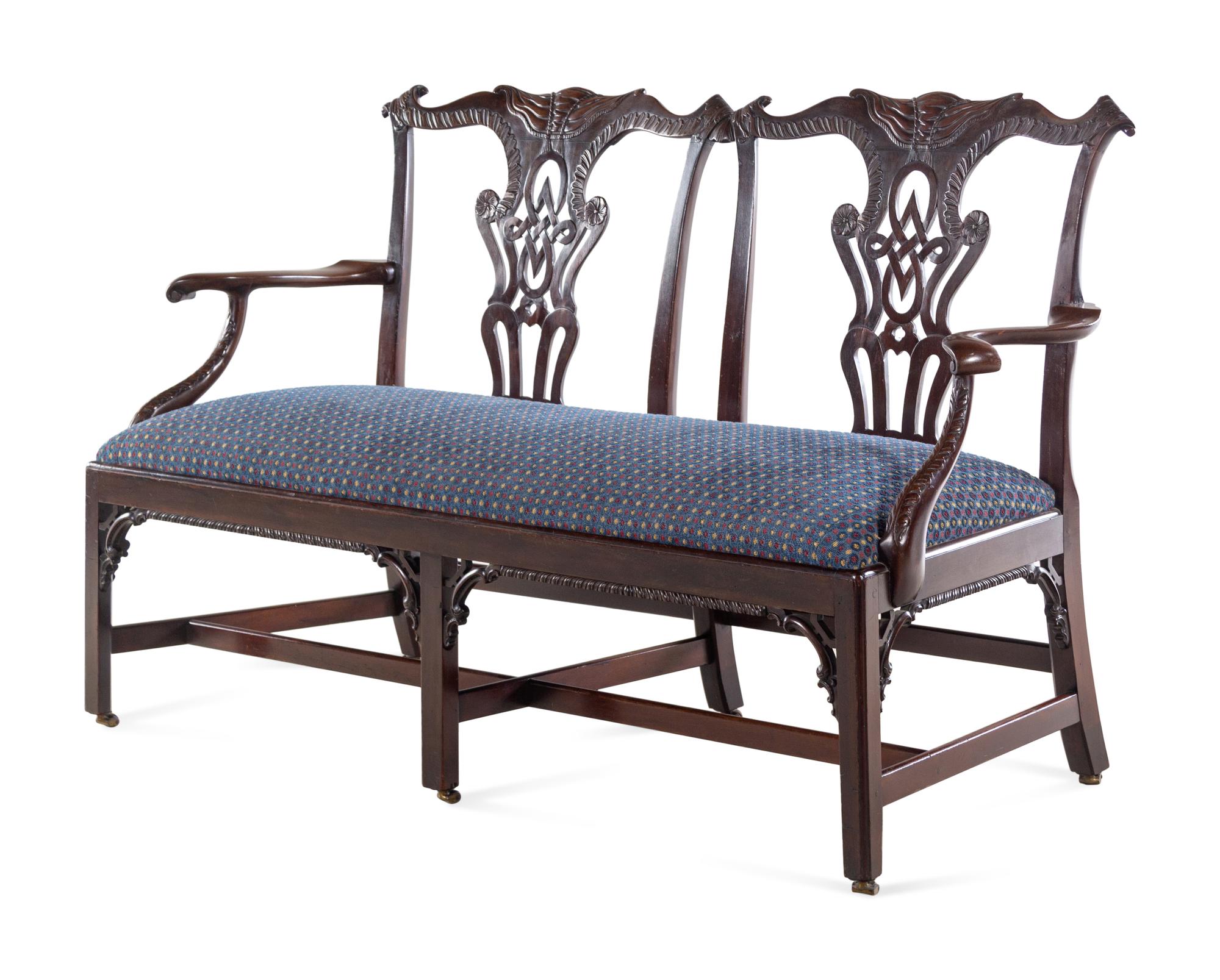 A George III Style Carved Mahogany Double Chair-Back Settee after a Design by Thomas Chippendale