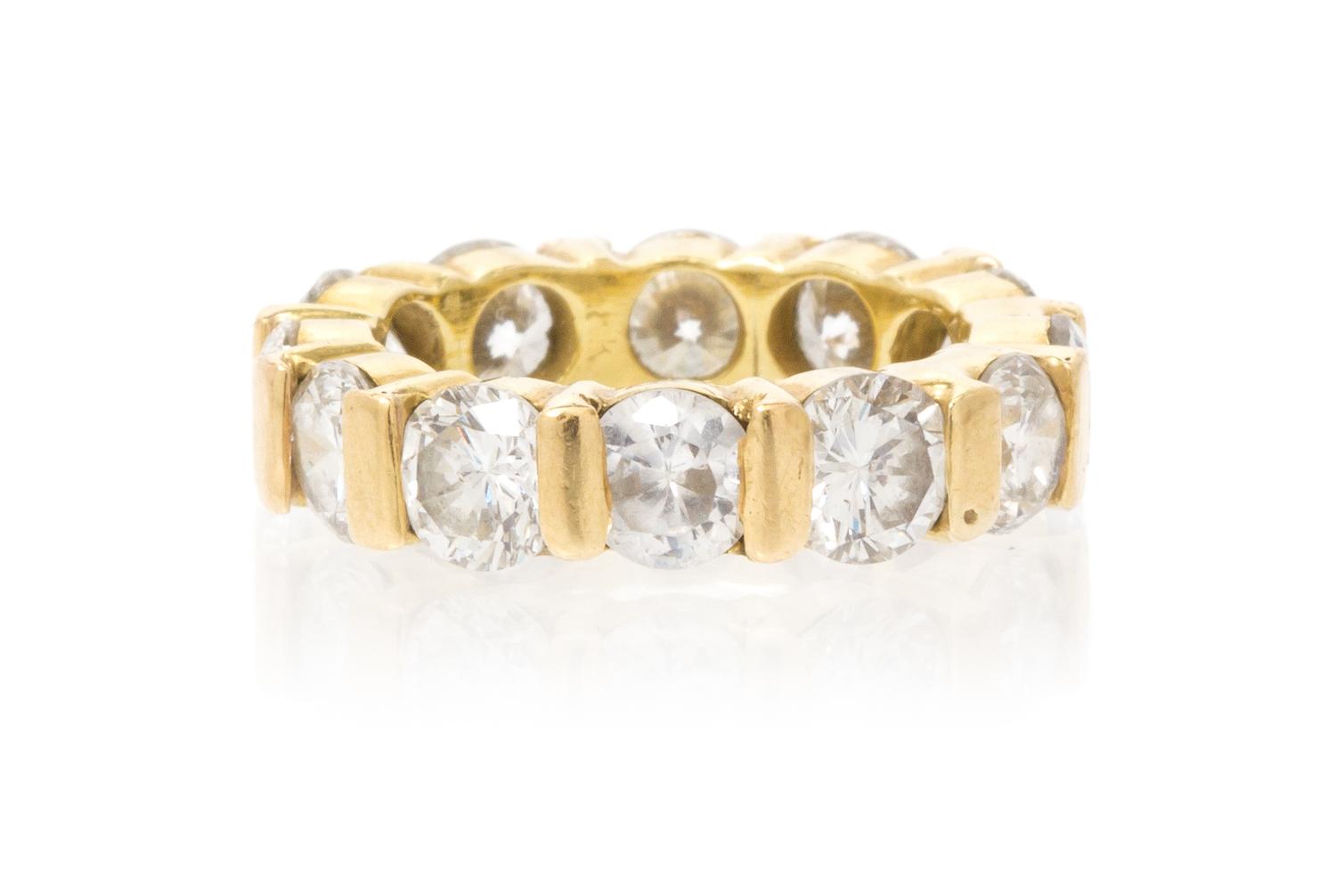 A Yellow Gold, Diamond and Simulated Diamond Eternity Band, 5.50 dwts.