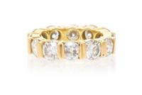 A Yellow Gold, Diamond and Simulated Diamond Eternity Band, 5.50 dwts.