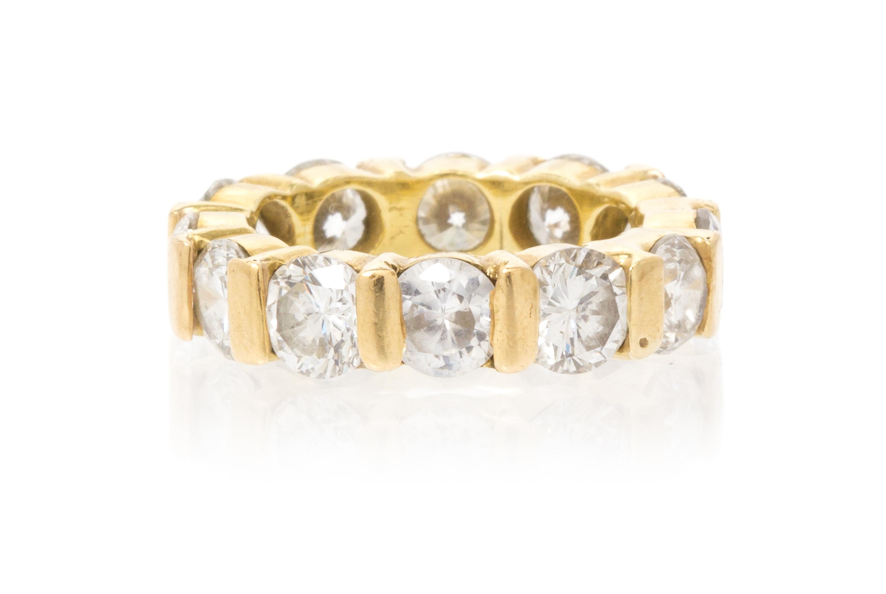 A Yellow Gold, Diamond and Simulated Diamond Eternity Band, 5.50 dwts.
