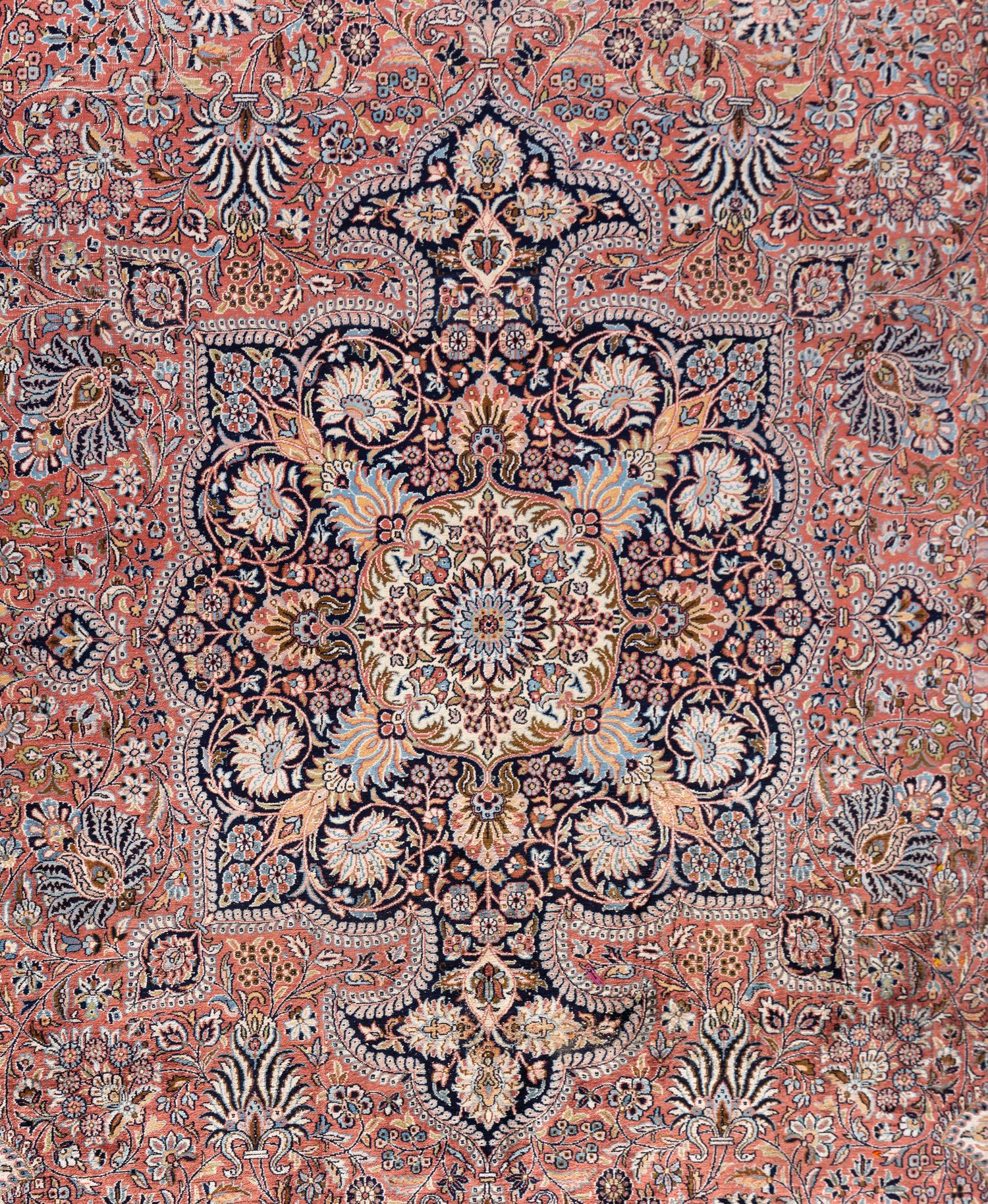 A Qom Wool and Silk Rug