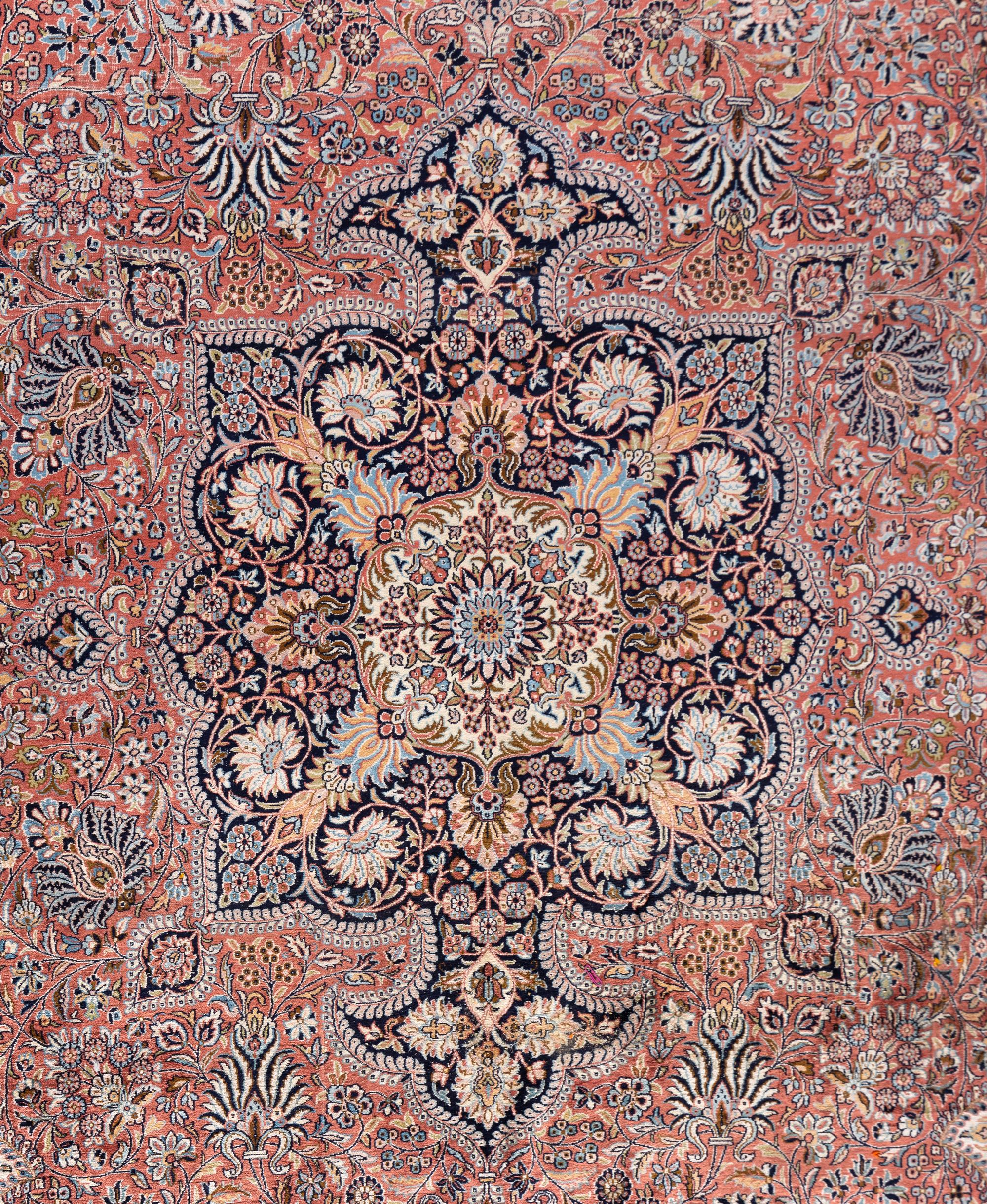 A Qom Wool and Silk Rug