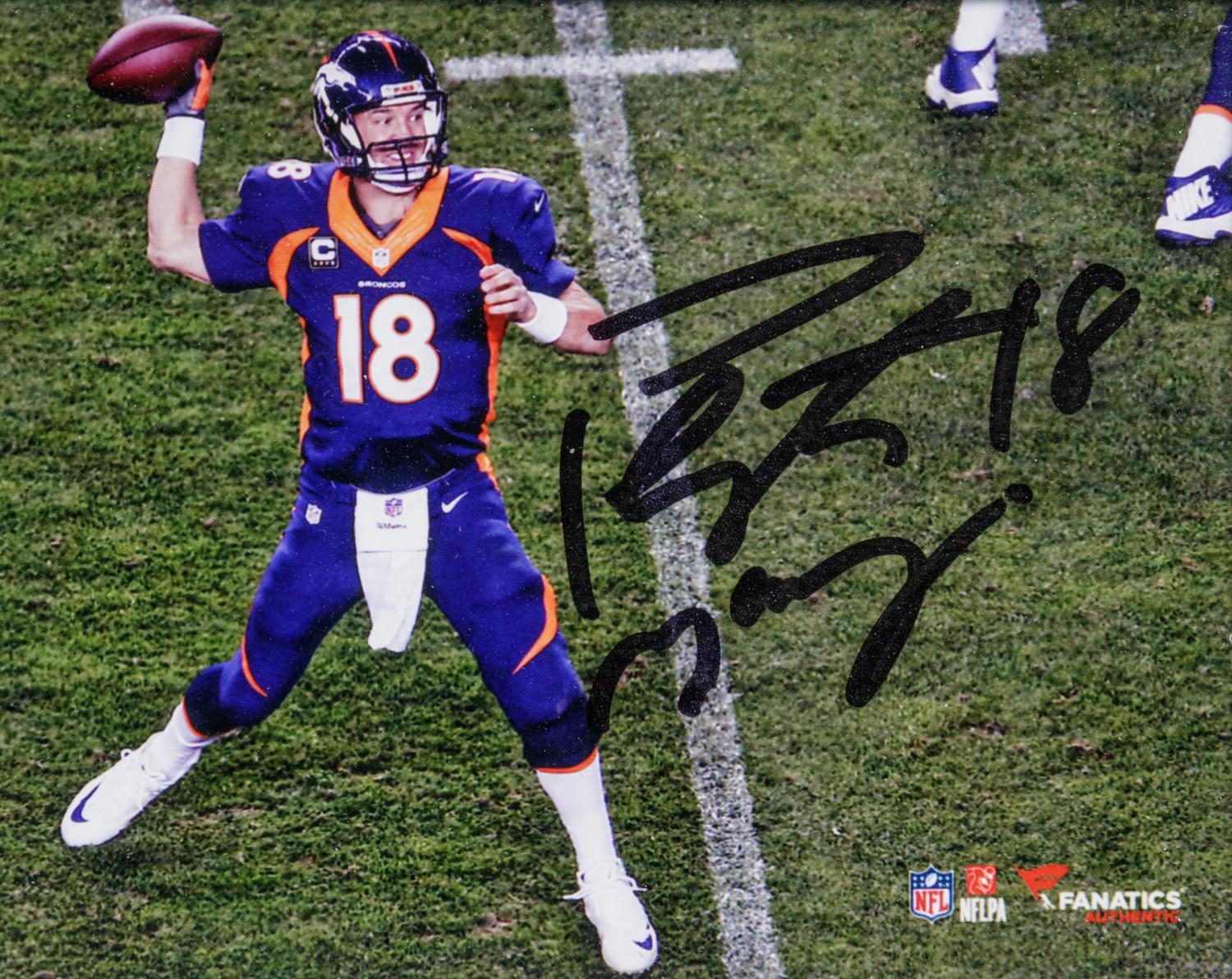 A Peyton Manning Signed Photograph and Game Used Football Fragment (Fanatics Authentic),