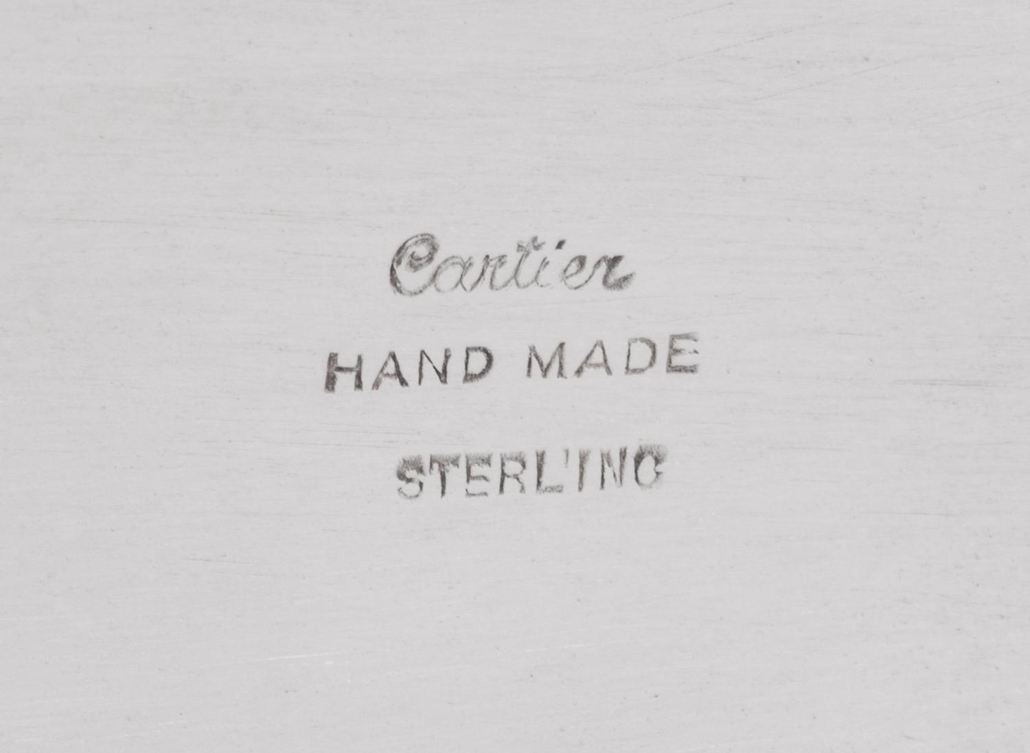 A Cartier Silver Table Article