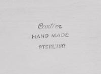 A Cartier Silver Table Article