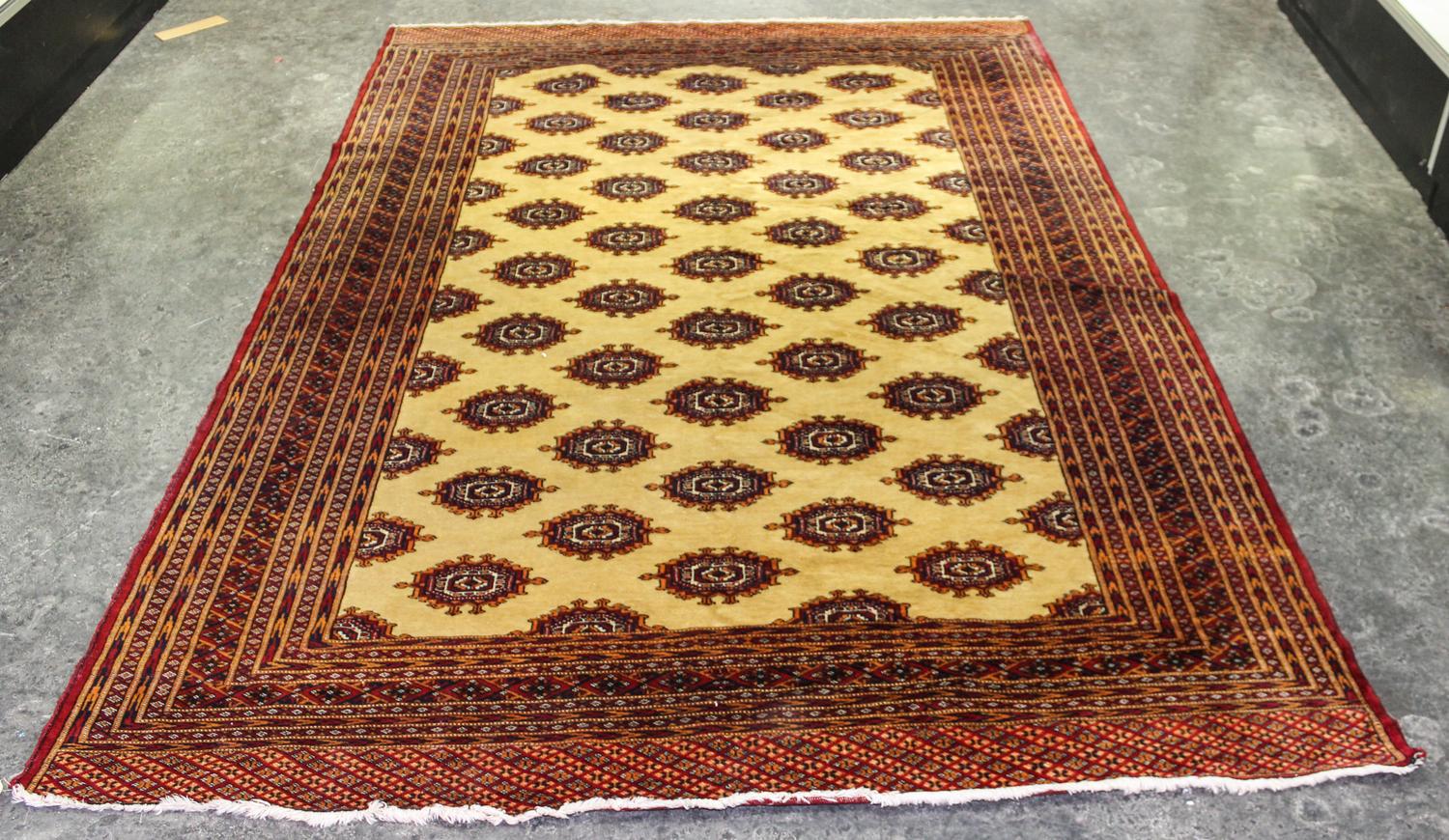 A Bokhara Wool Rug 8 feet 6 inches x 5 feet 11 inches.