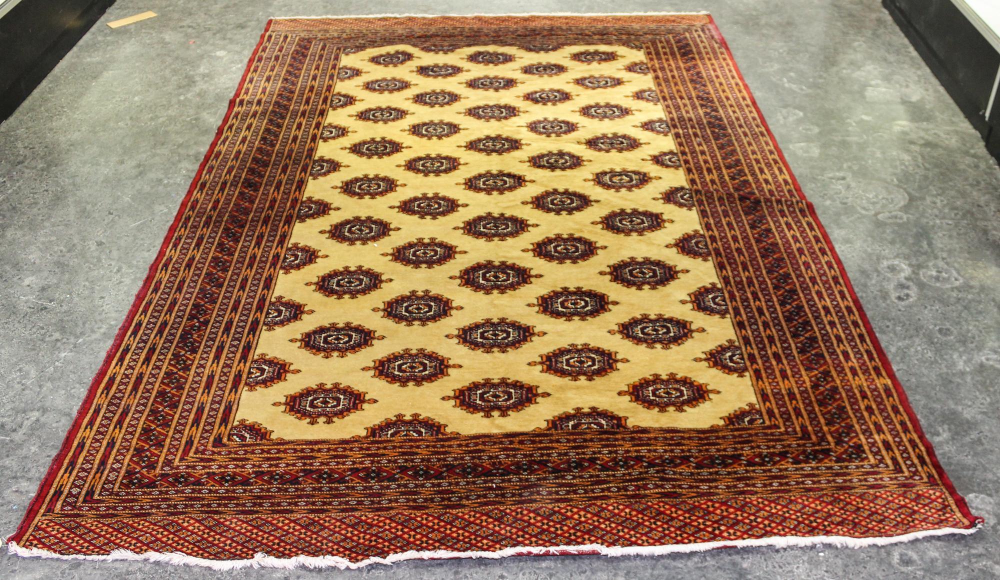 A Bokhara Wool Rug 8 feet 6 inches x 5 feet 11 inches.