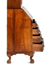 A Chippendale Mahogany and Cherrywood Serpentine Claw-and-Ball Foot Desk-and-Bookcase