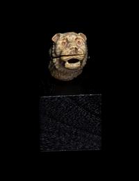 An Egyptian Bone Head of a Lion