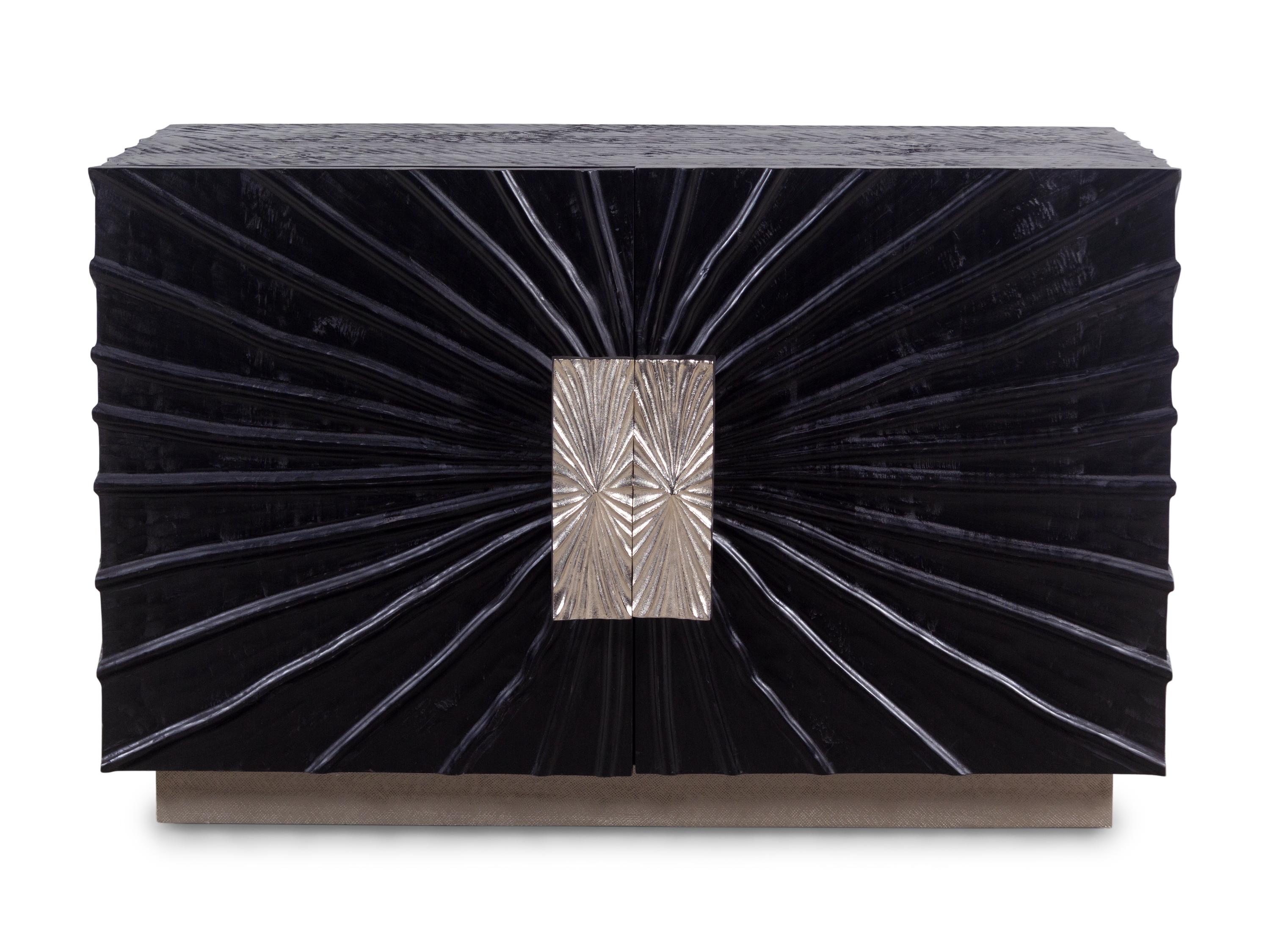 A Contemporary Ebonized Sculpture-Front Cabinet