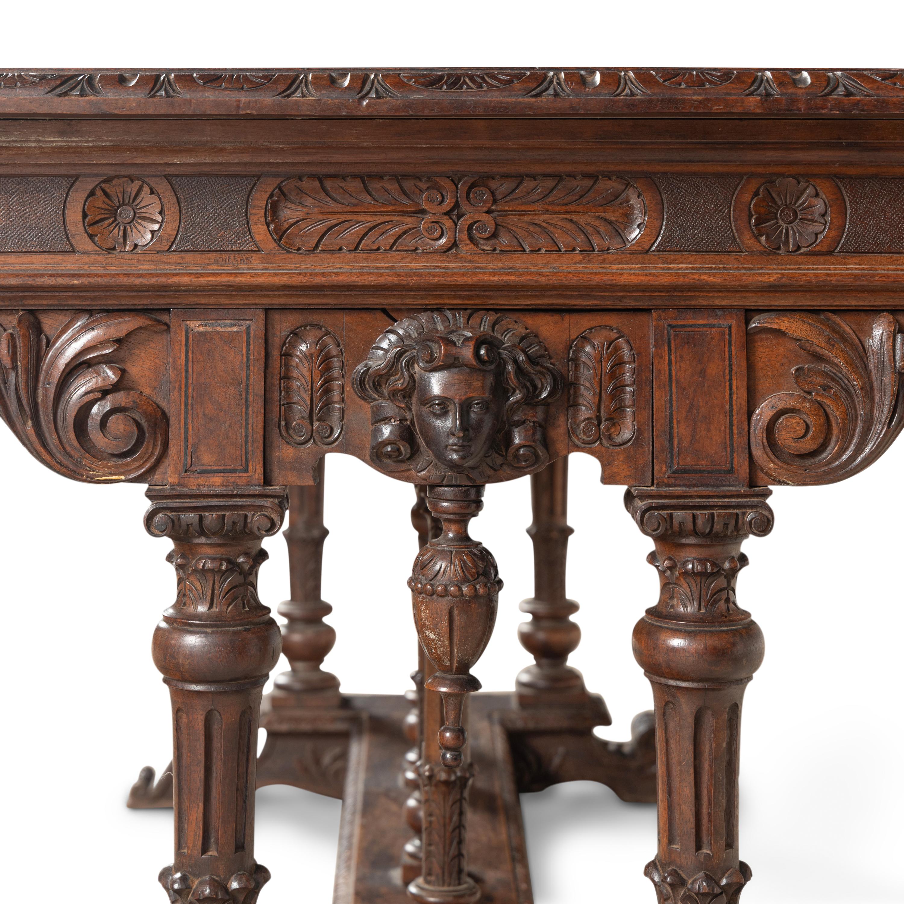 An Italian Carved Walnut Library Table