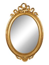 A Louis XV Style Giltwood Framed Oval Mirror — 19TH CENTURY