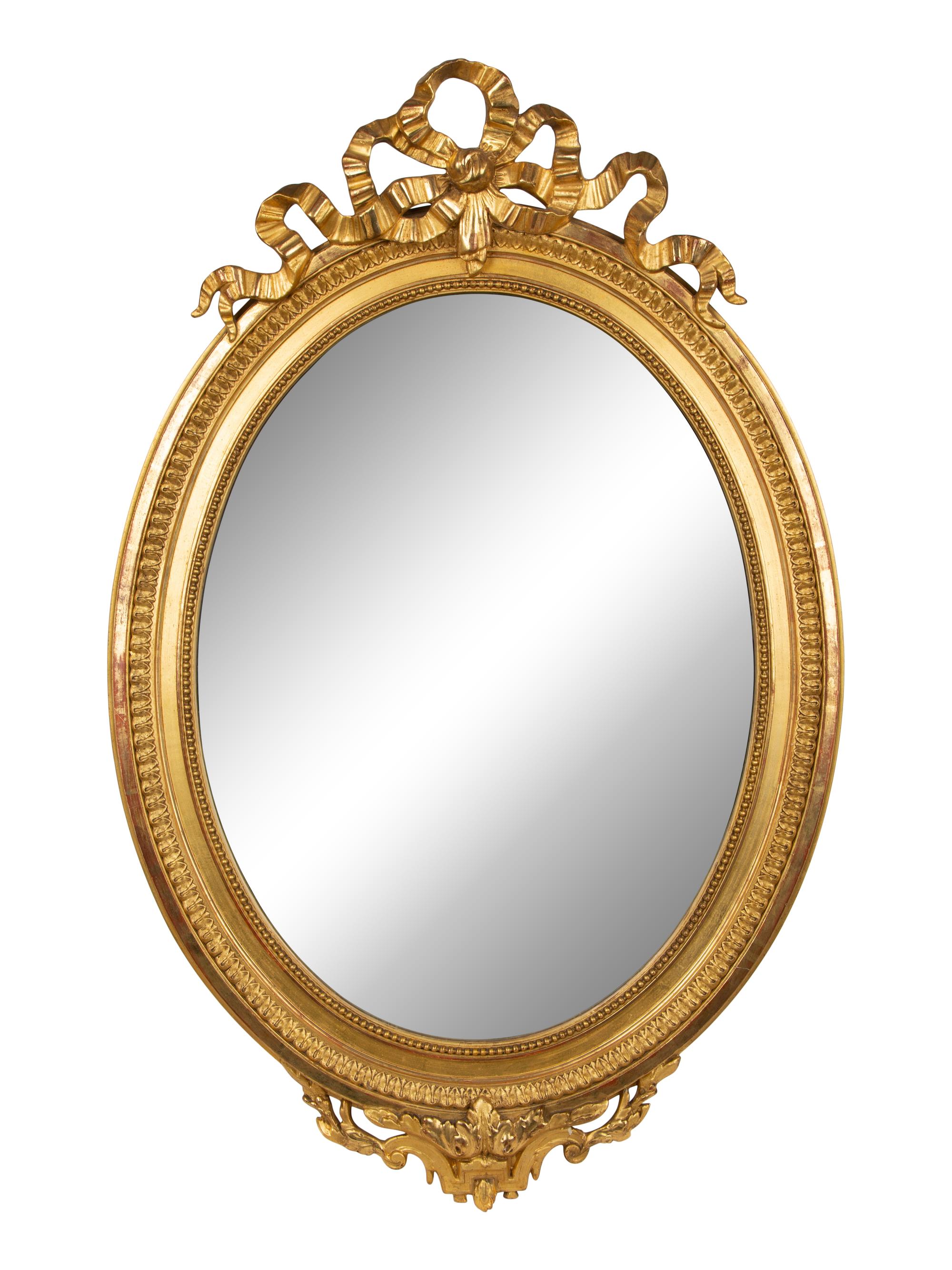 A Louis XV Style Giltwood Framed Oval Mirror — 19TH CENTURY