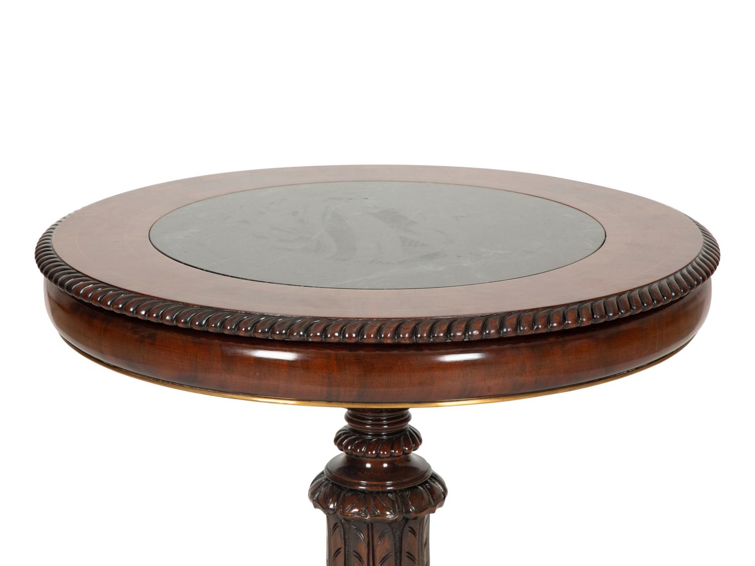 A Regency Style Mahogany and Rosewood Crossbanded Center Table with Inset Marble Top