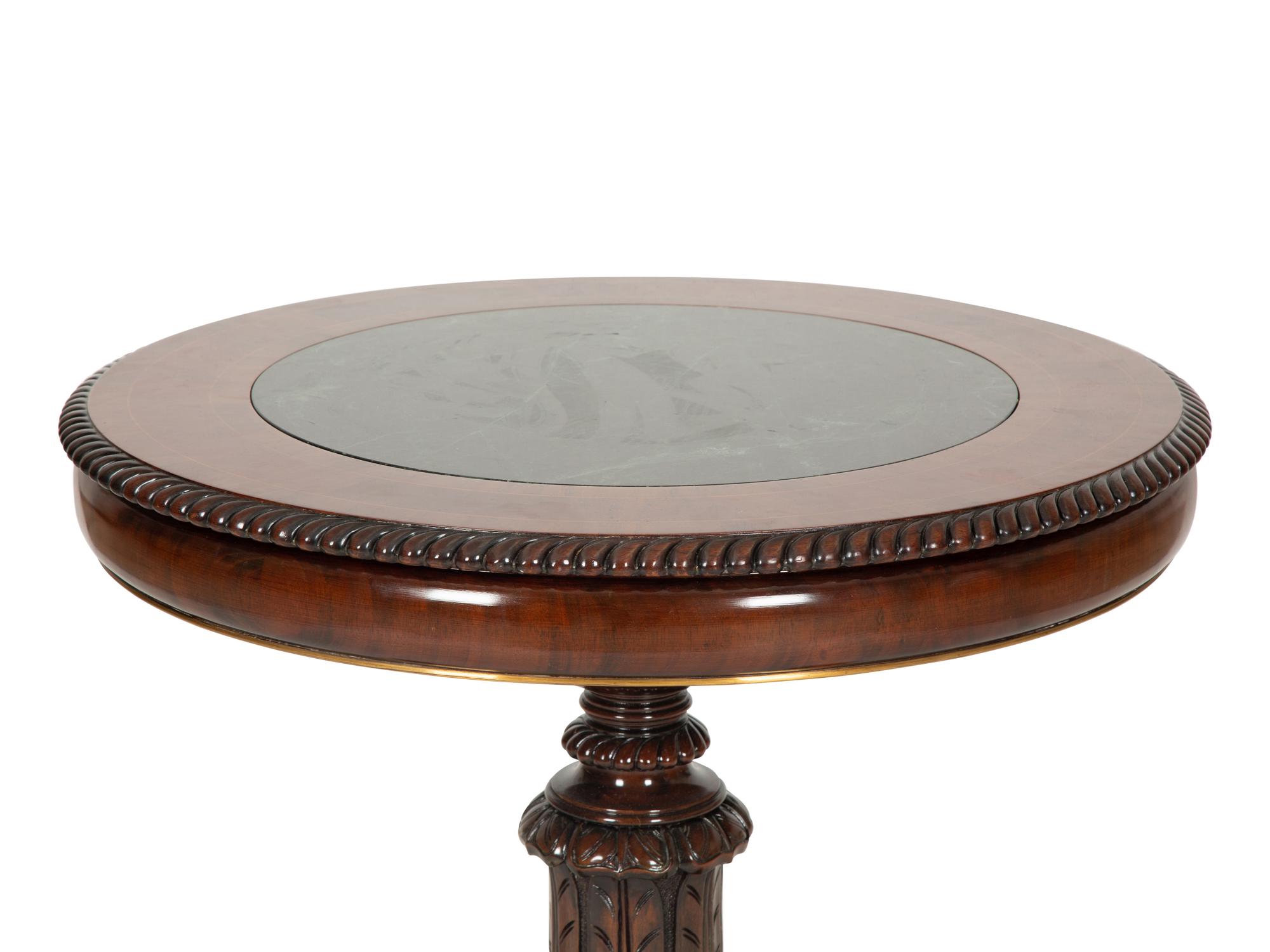A Regency Style Mahogany and Rosewood Crossbanded Center Table with Inset Marble Top