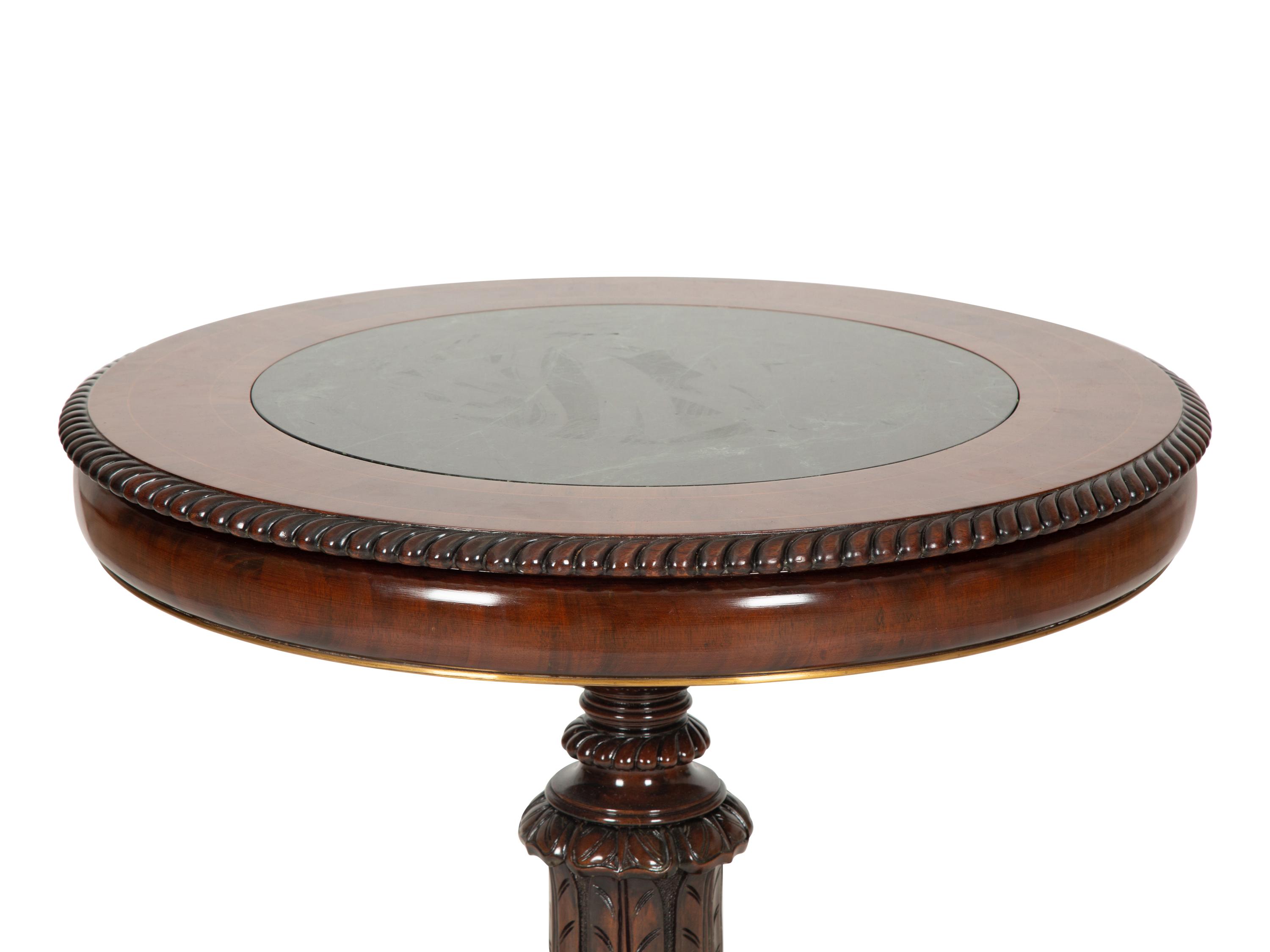 A Regency Style Mahogany and Rosewood Crossbanded Center Table with Inset Marble Top