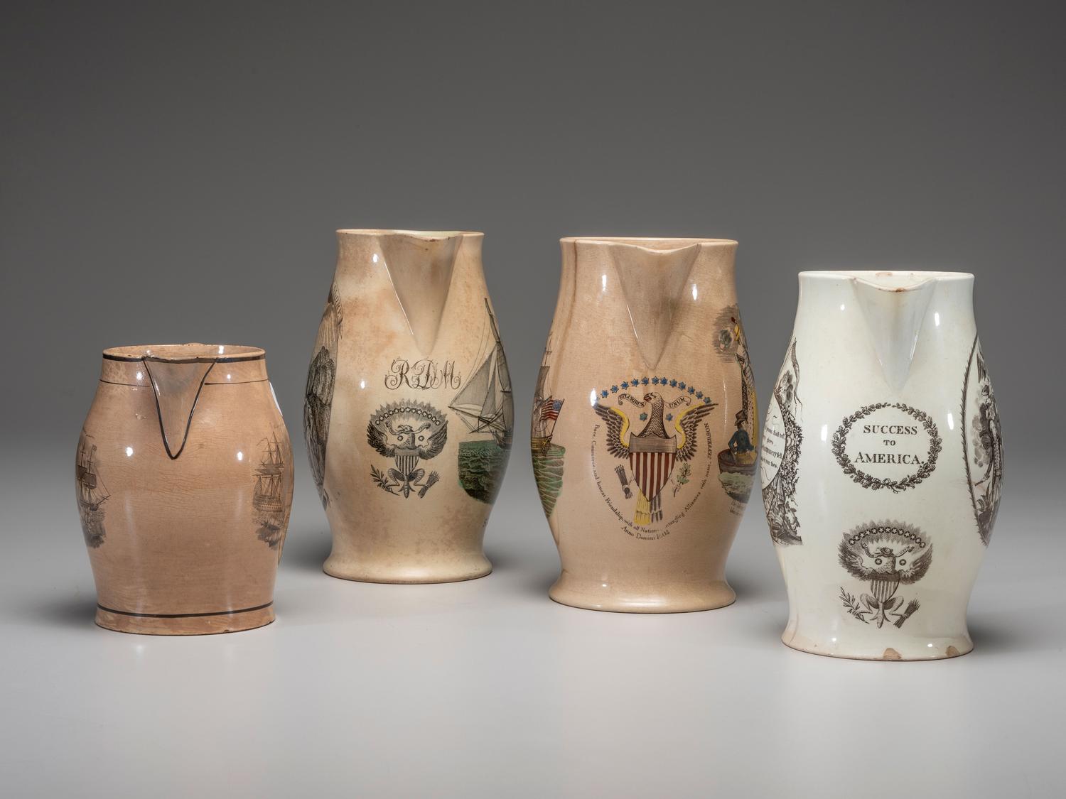 Four Patriotic Creamware Pitchers