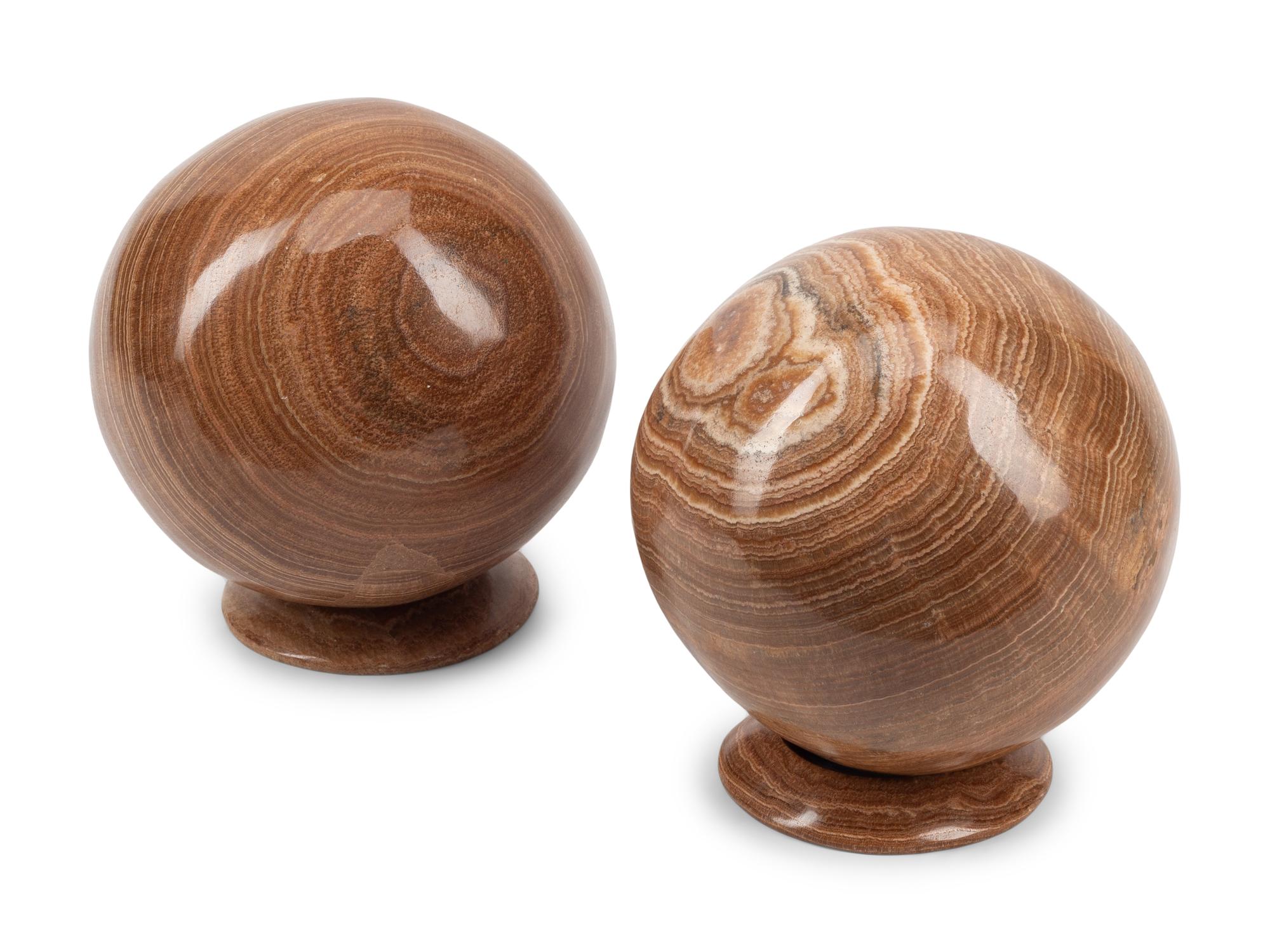 A Pair of Carved Agate Spherical Ornaments with Stands