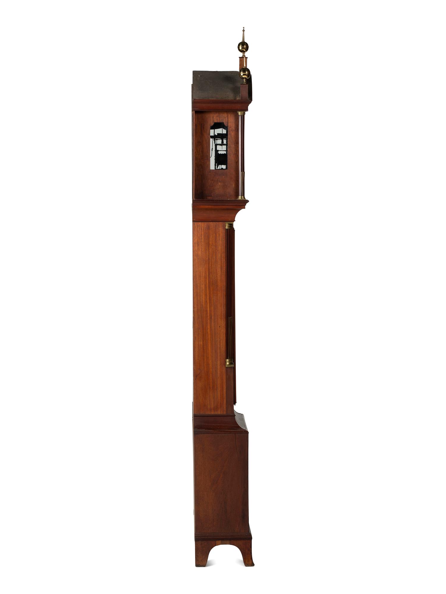 A Federal Carved and Inlaid, Brass-Mounted Mahogany Tall Case Clock