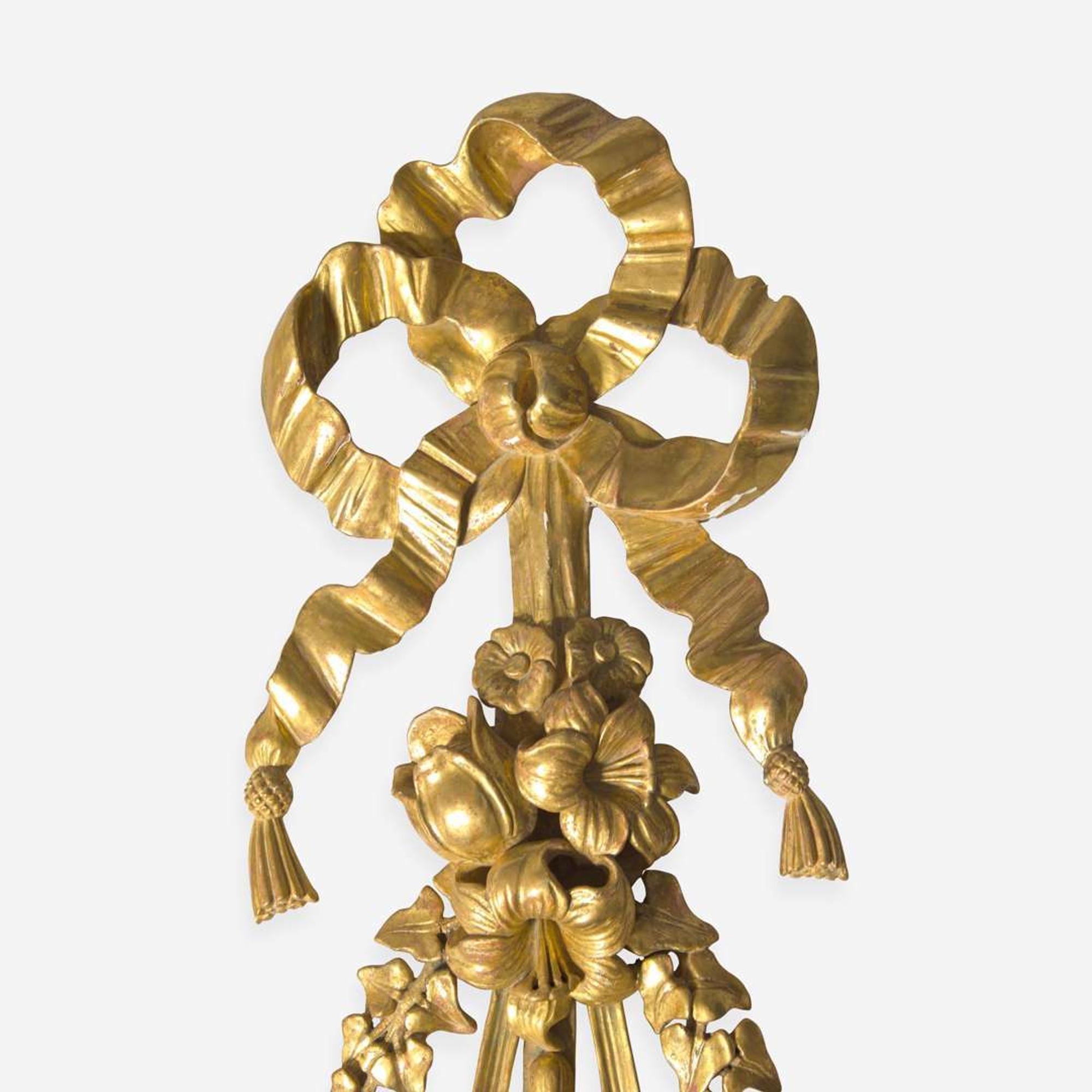 A group of four Georgian style giltwood ribbon, fruit, and floral swag wall appliques late 19th / 20th century