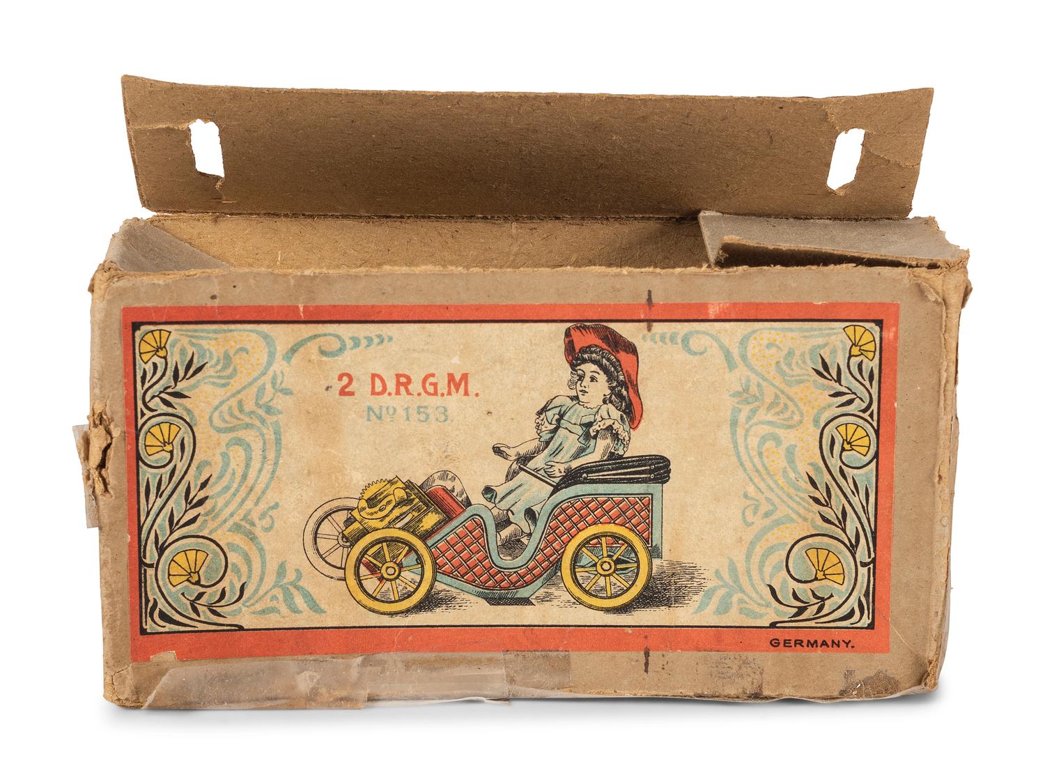 A D.R.G.M. Tin Car Toy with Doll and Original Box