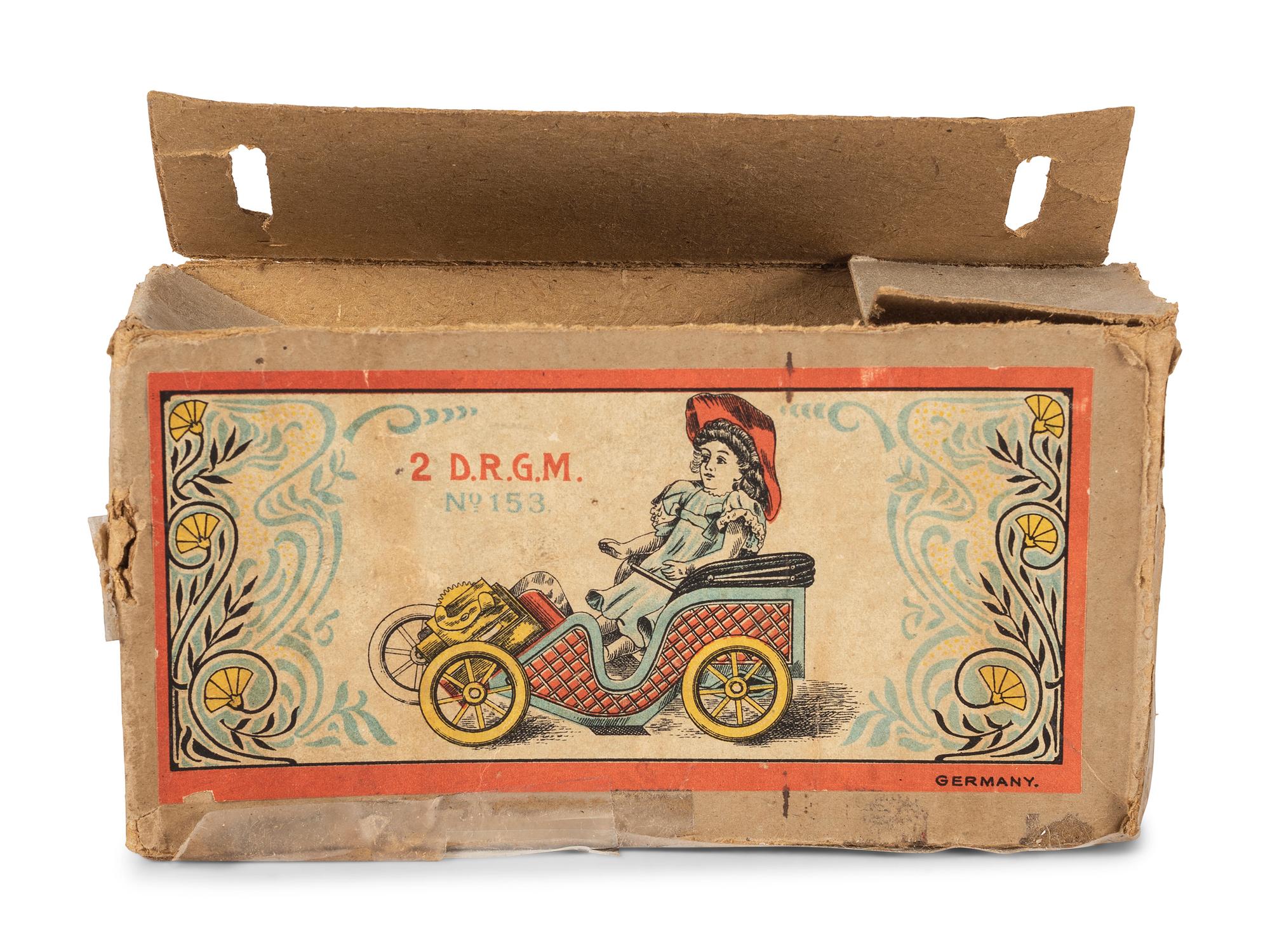 A D.R.G.M. Tin Car Toy with Doll and Original Box