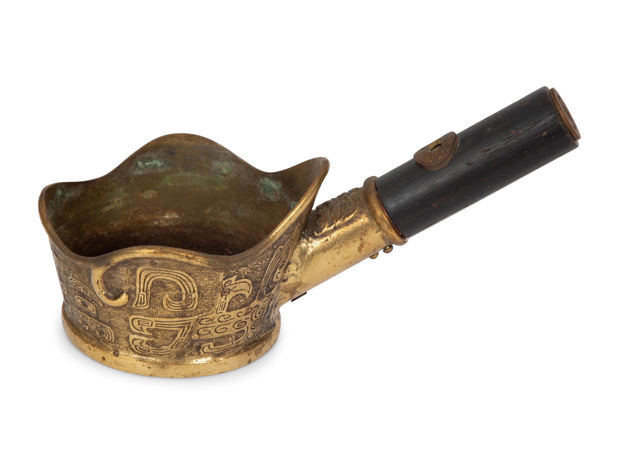 A Chinese Brass Silk Iron, Two Gunpowder Flasks and a Horn Vessel