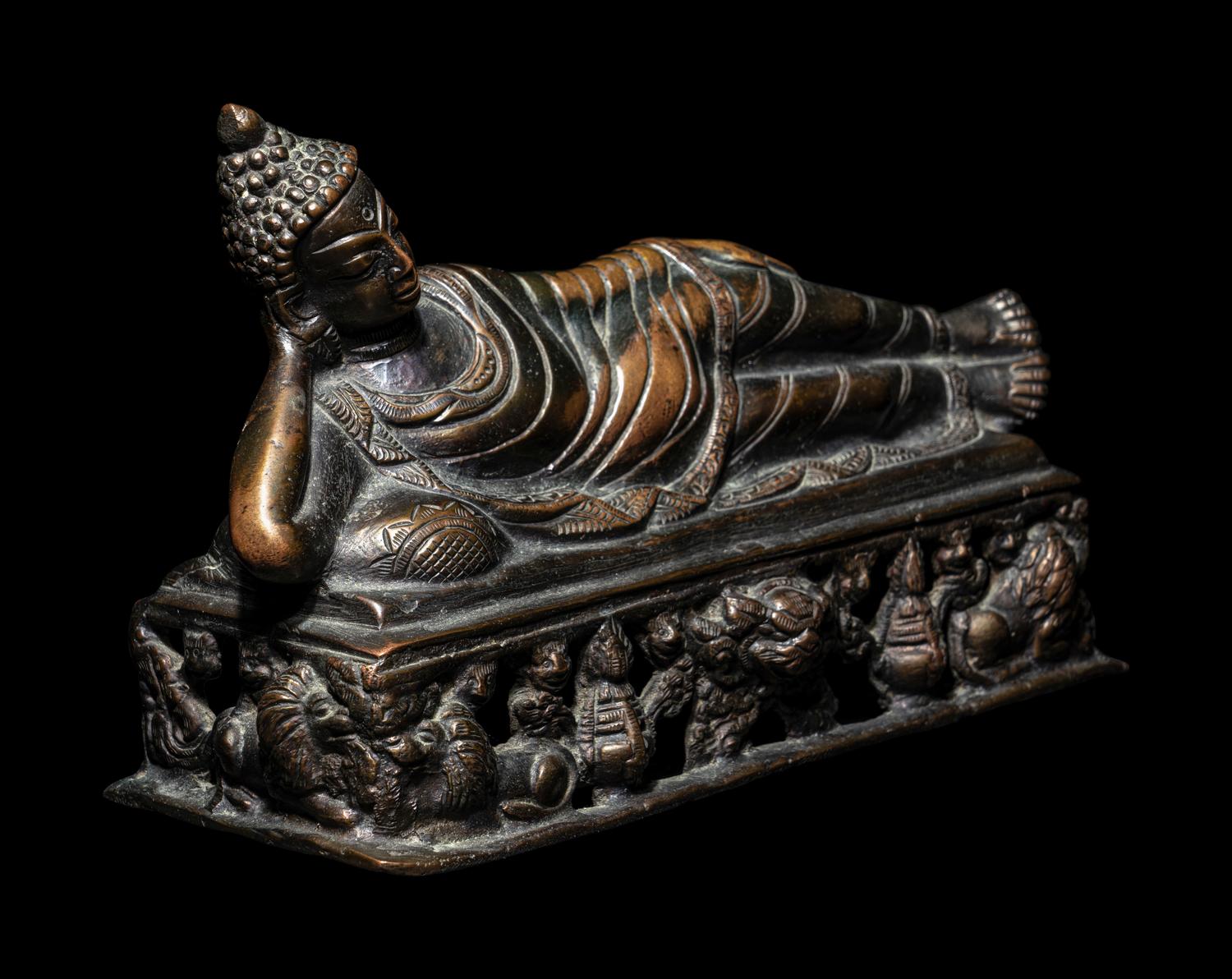 A Tibetan Bronze Figure of a Reclining Buddha