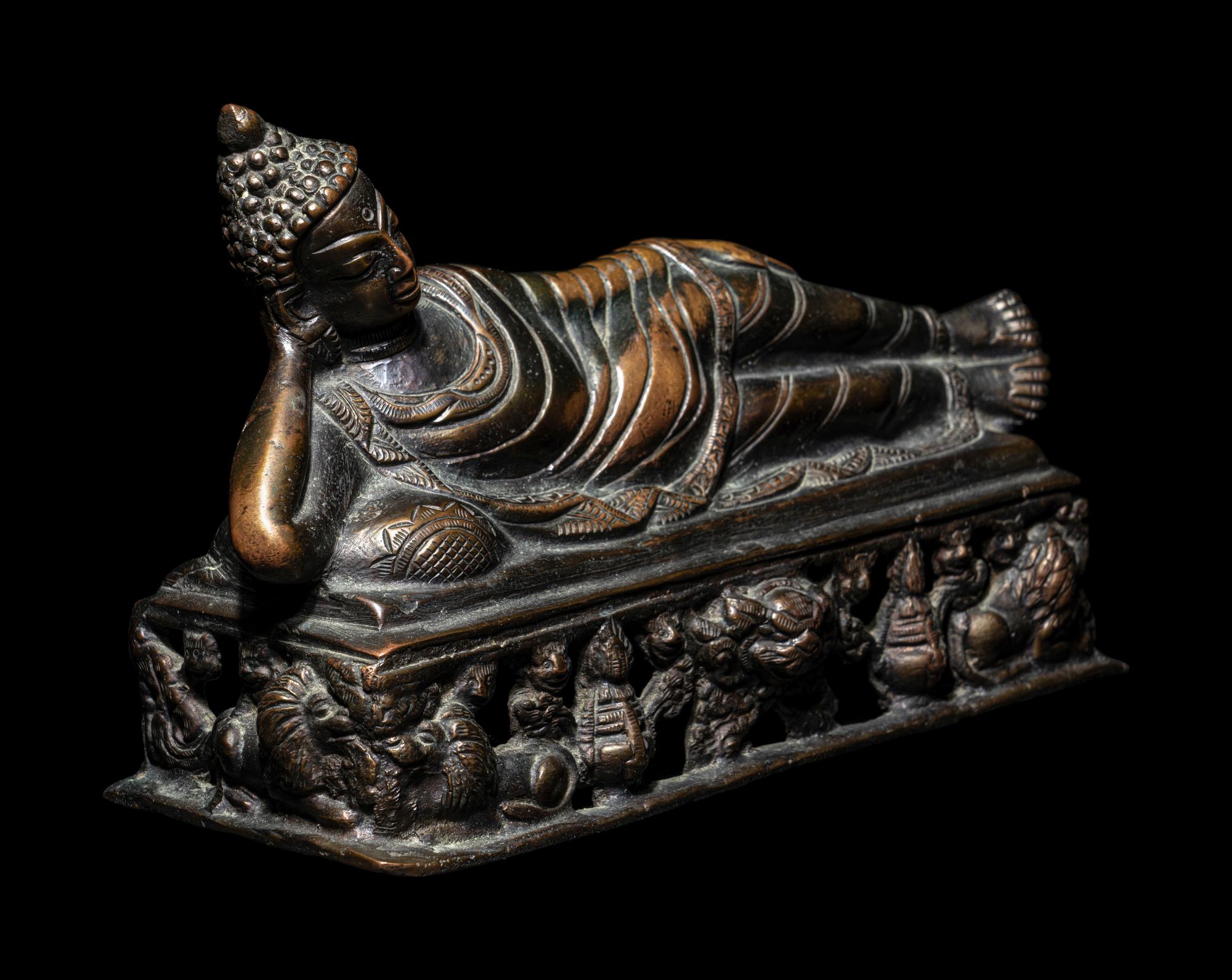 A Tibetan Bronze Figure of a Reclining Buddha