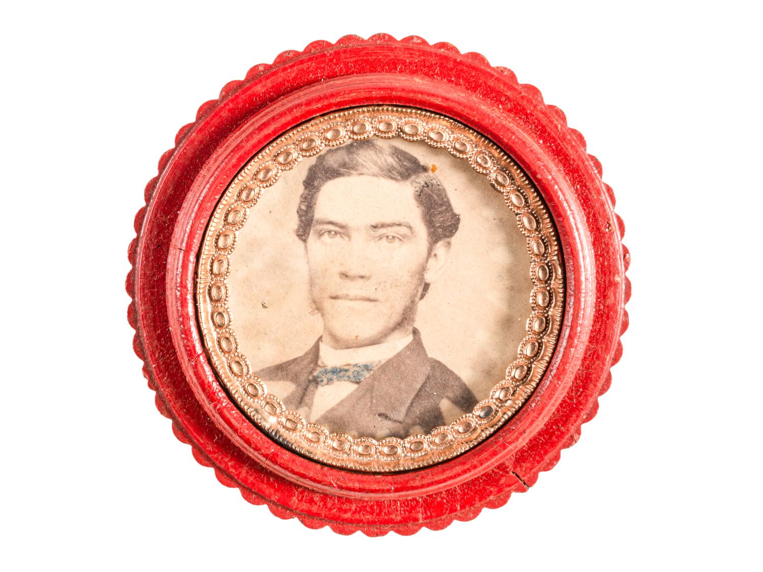 [EARLY PHOTOGRAPHY - UNION CASES]. A group of 7 red "oreo" cases containing assorted portraits, including: