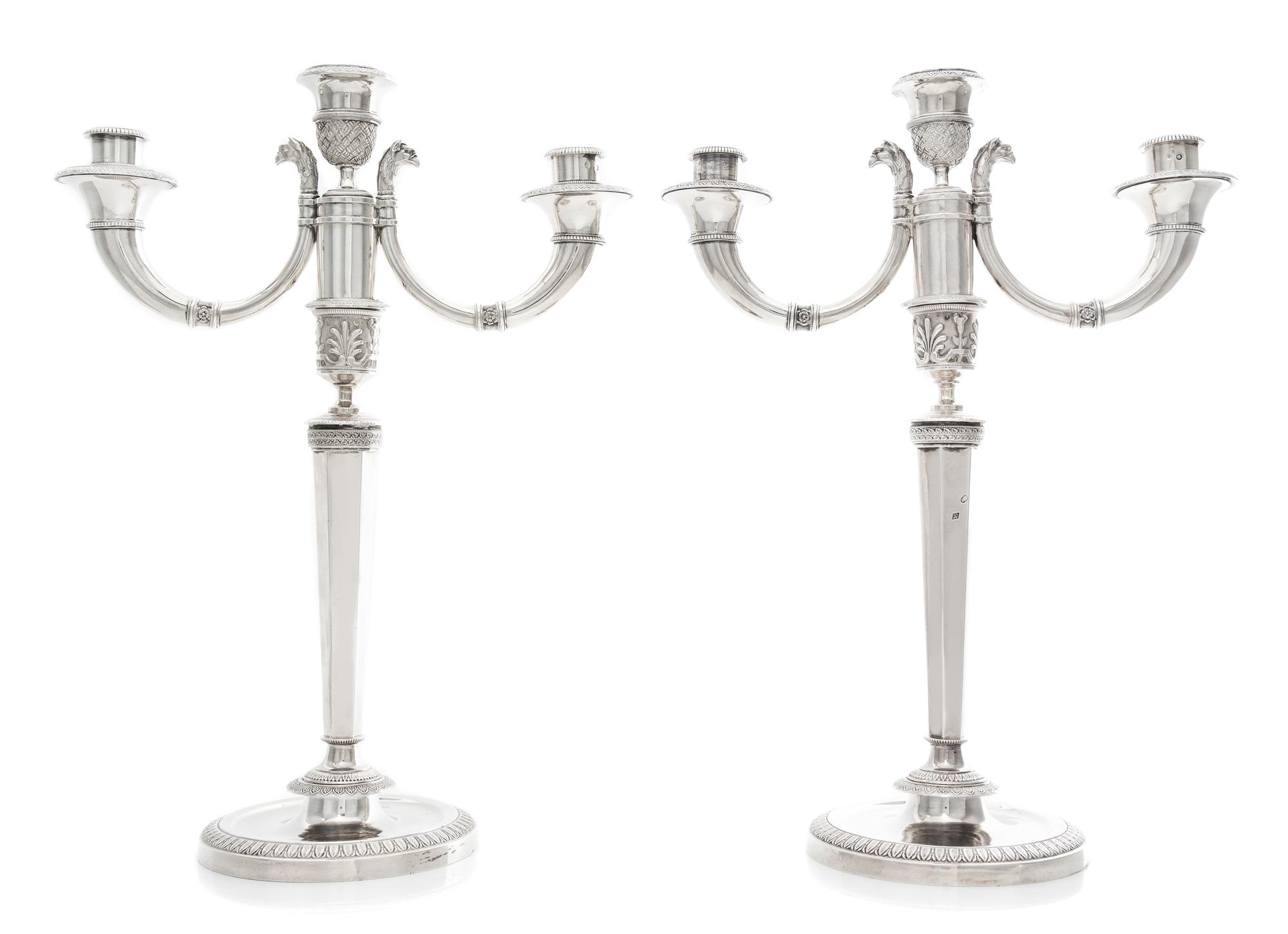 A Pair of French Silver Three-Light Candelabra, Maker's Mark CBA, 19th Century, the stem of faceted tapering form issuing two scrolling