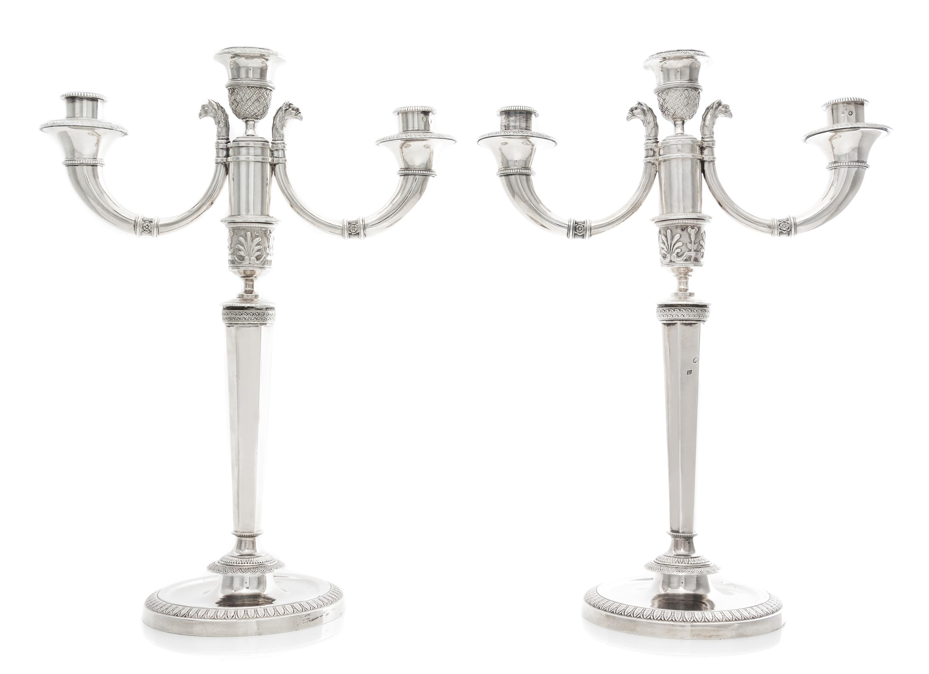 A Pair of French Silver Three-Light Candelabra, Maker's Mark CBA, 19th Century, the stem of faceted tapering form issuing two scrolling