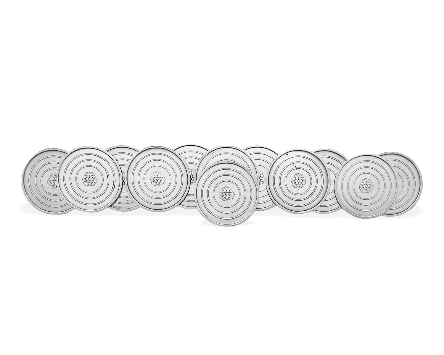 A Set of Twelve Georg Jensen Silver Coasters