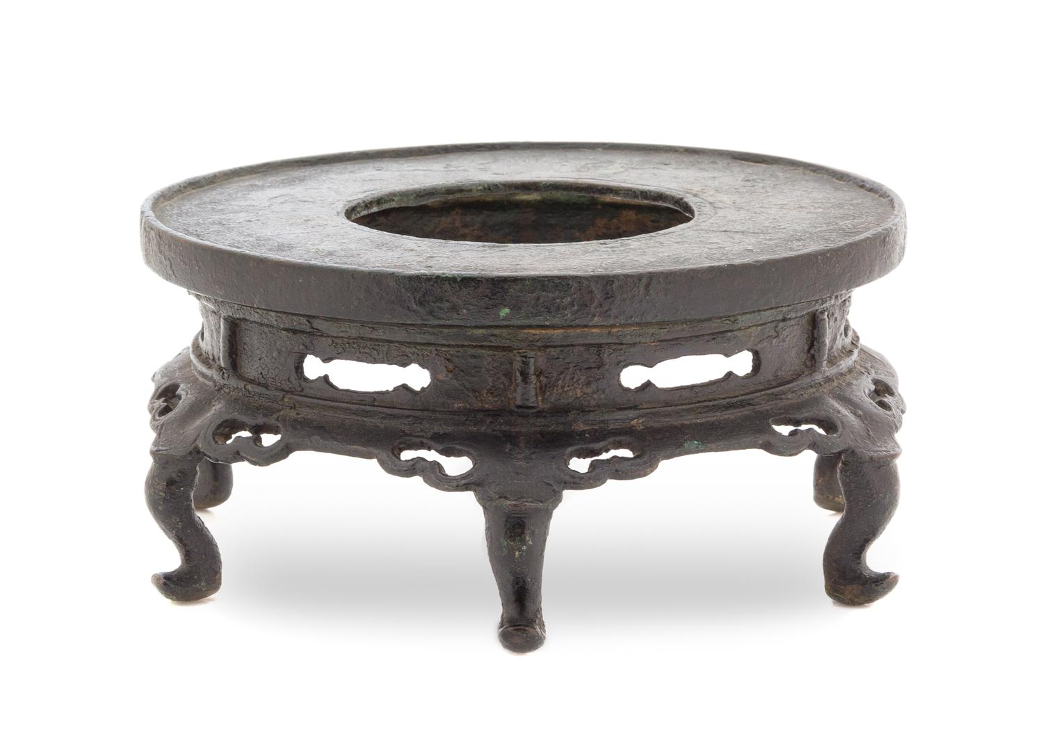 A Chinese Bronze Pedestal Stand YUAN/MING DYNASTY Height 3 1/2 x diameter 7 inches. — YUAN/MING DYNASTY