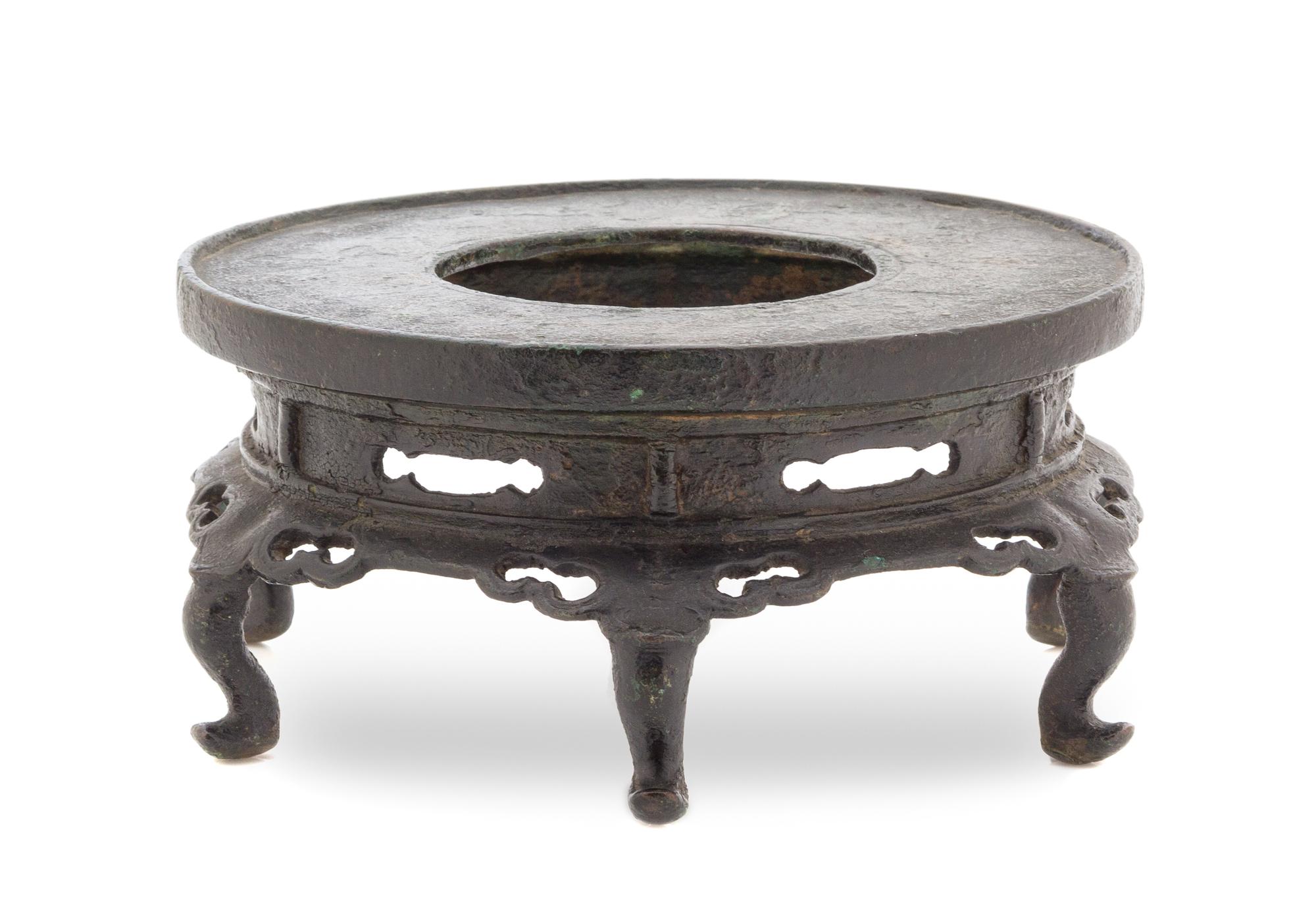 A Chinese Bronze Pedestal Stand YUAN/MING DYNASTY Height 3 1/2 x diameter 7 inches. — YUAN/MING DYNASTY