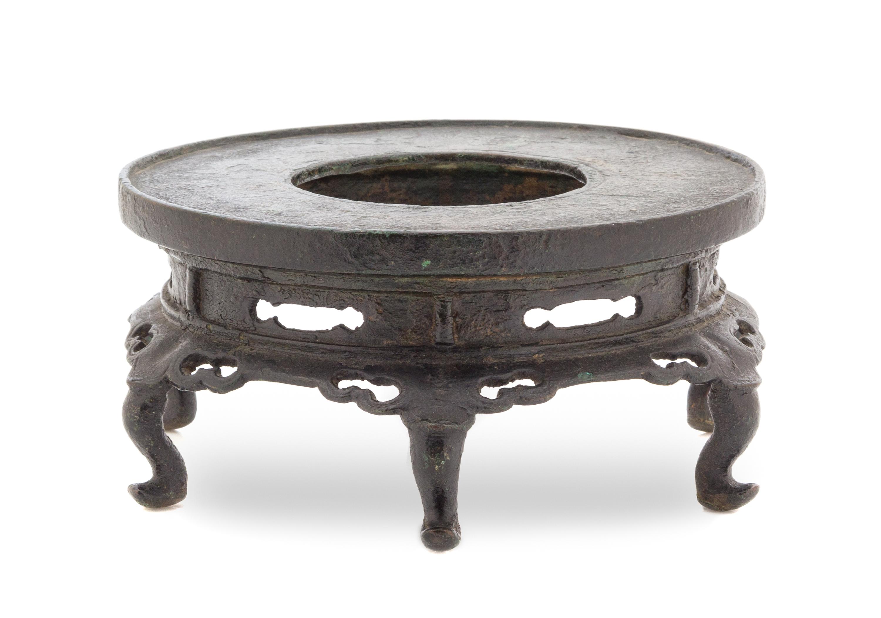 A Chinese Bronze Pedestal Stand YUAN/MING DYNASTY Height 3 1/2 x diameter 7 inches. — YUAN/MING DYNASTY